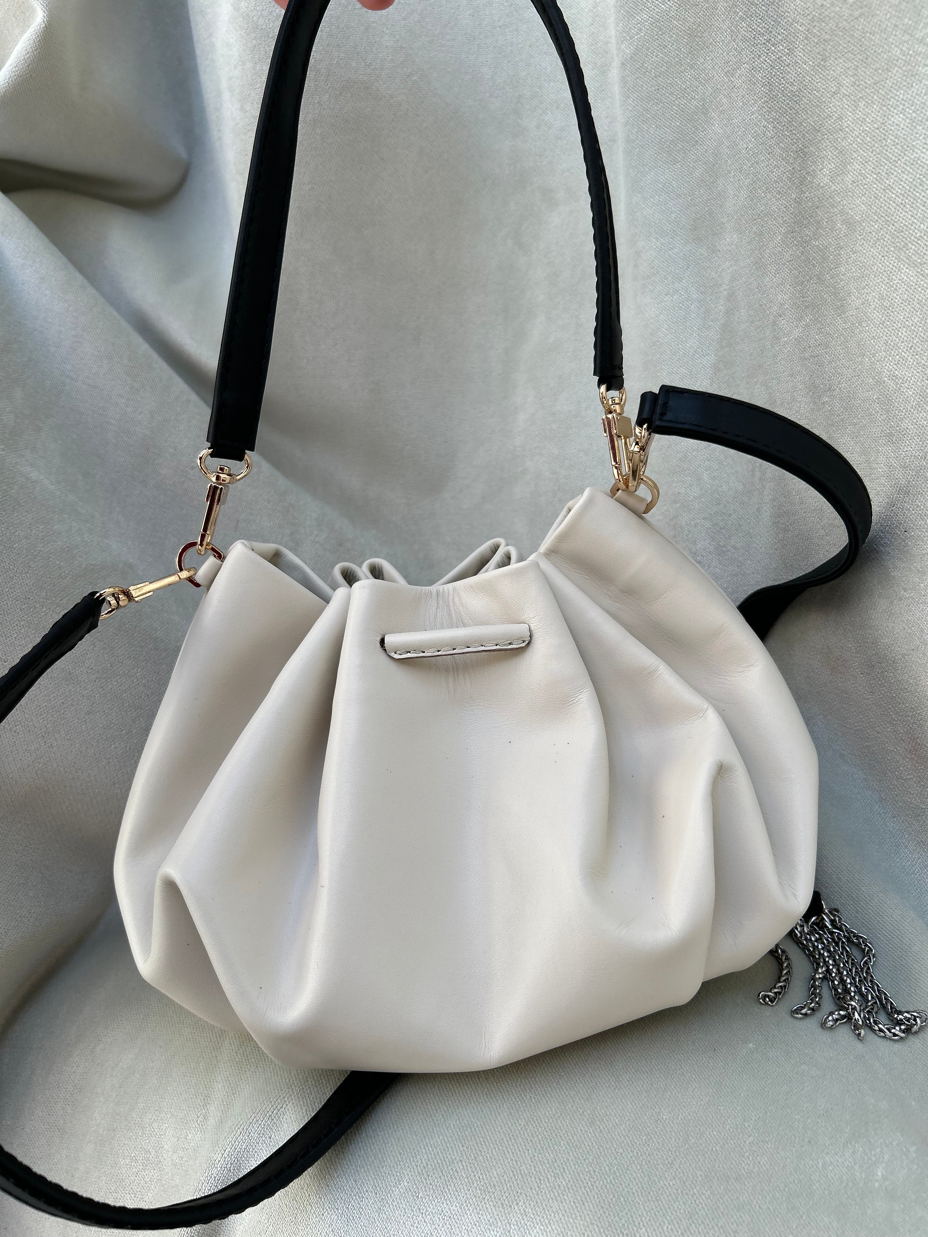 Mini "Retro" bag with a handle and a shoulder strap. Black and white leather.