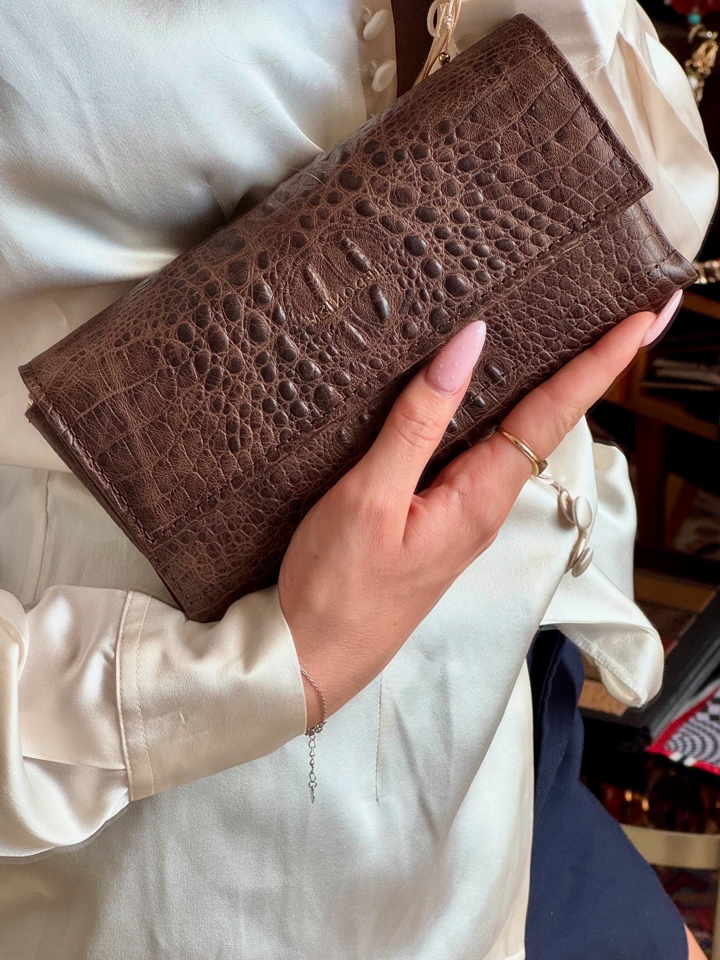 "All in one" 4-in-1 bag, crocodile-embossed leather. Available in several colors.