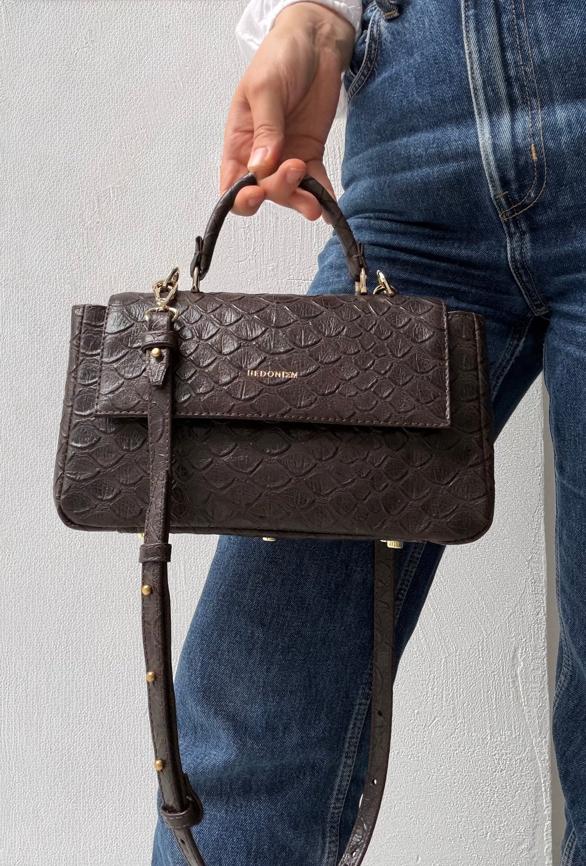 "Audrey" embossed scale-effect leather. Available in two colours