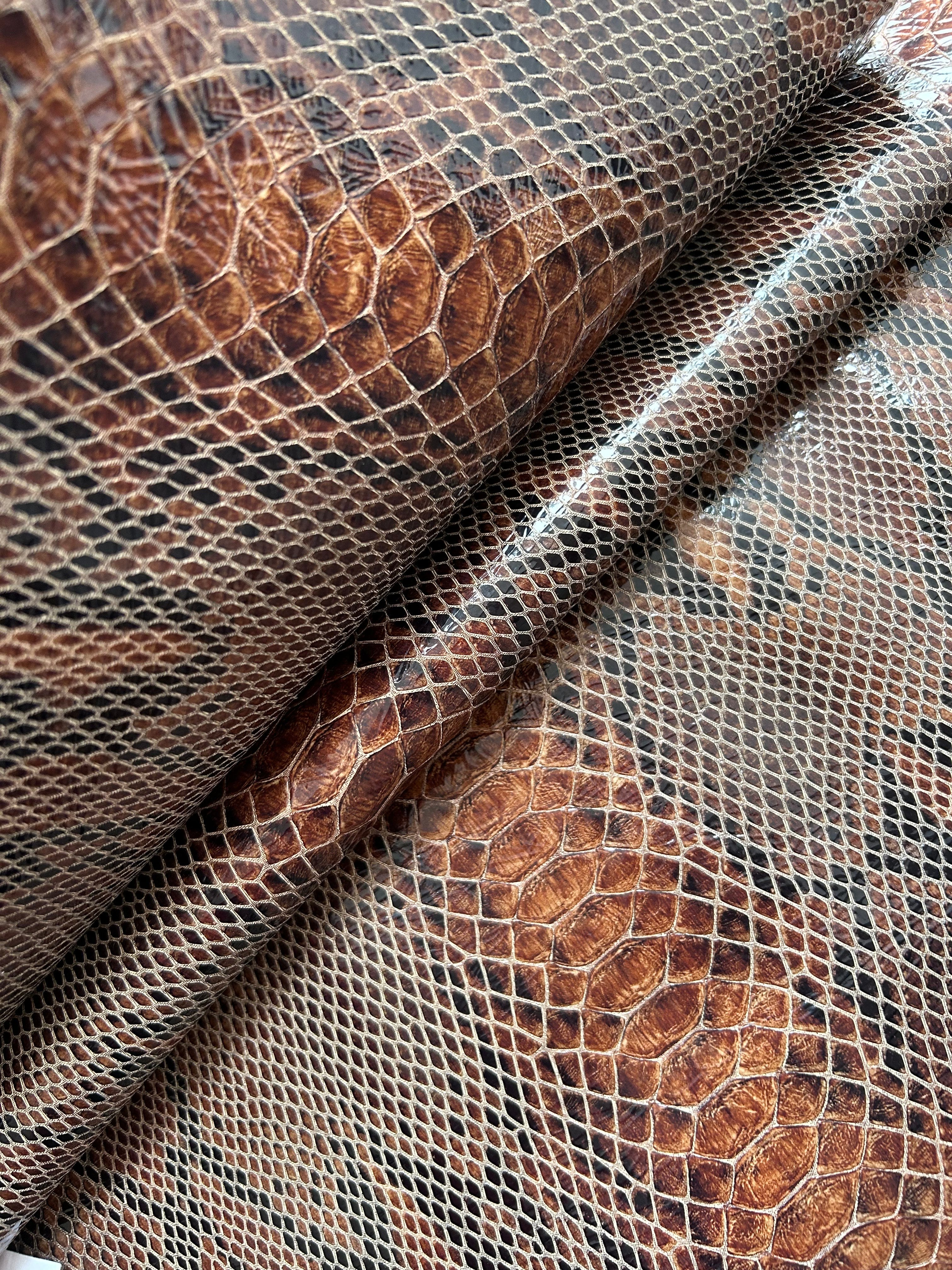 "Audrey Baguette" snake-embossed leather. Available in two colors.