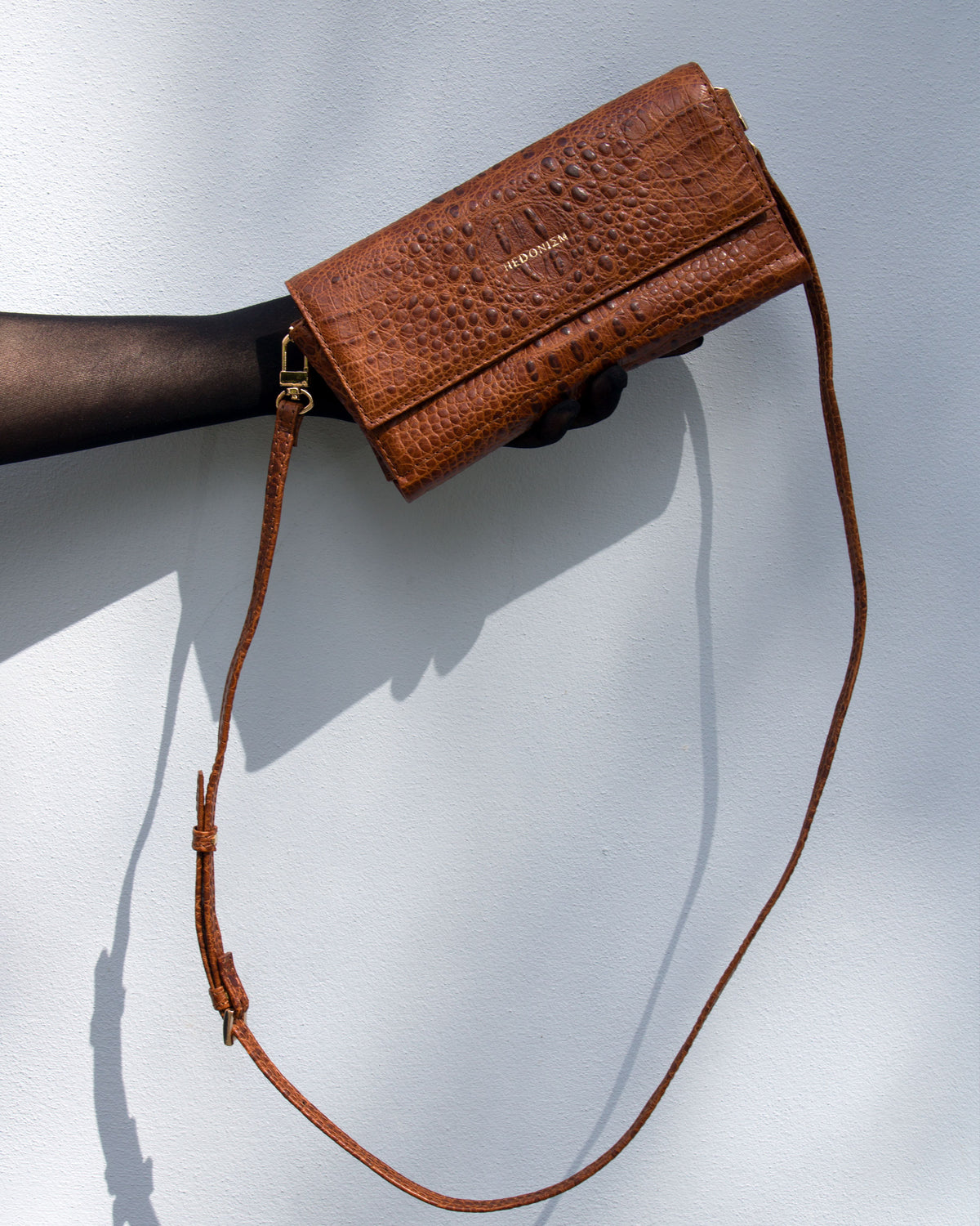 "All in one" 4-in-1 bag, crocodile-embossed leather. Available in several colors.