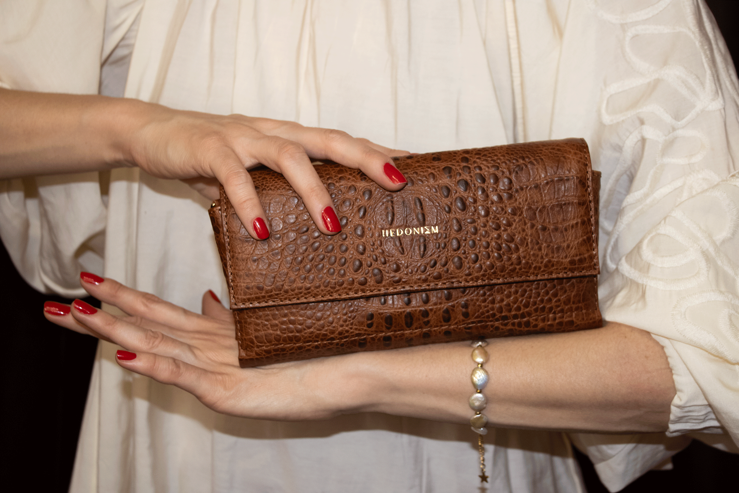 "All in one" 4-in-1 bag, crocodile-embossed leather. Available in several colors.