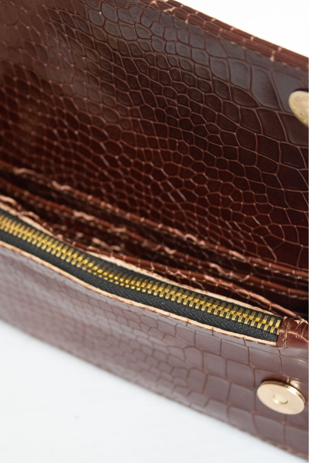 "All in one" 4-in-1 bag, crocodile-embossed leather. Available in several colors.