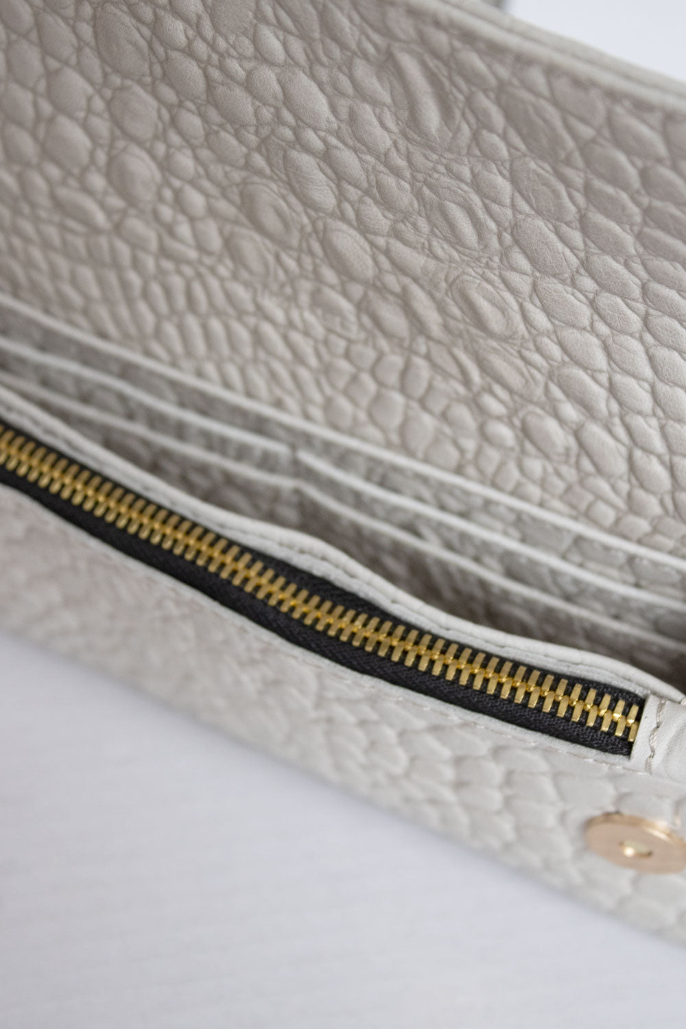 "All in one" 4-in-1 handbag, cream crocodile-embossed leather