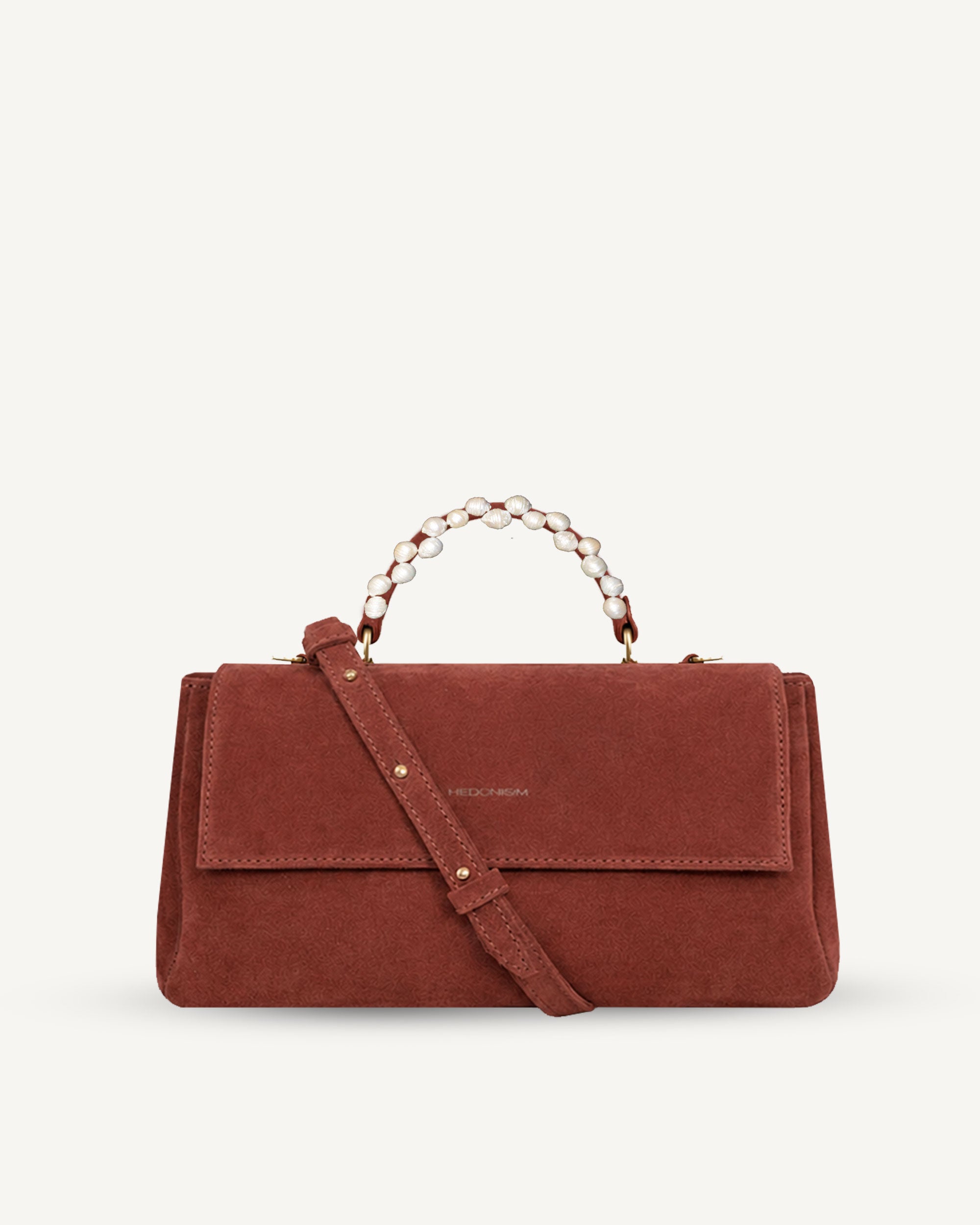 "Audrey Baguette" snake-embossed leather. Available in two colors.