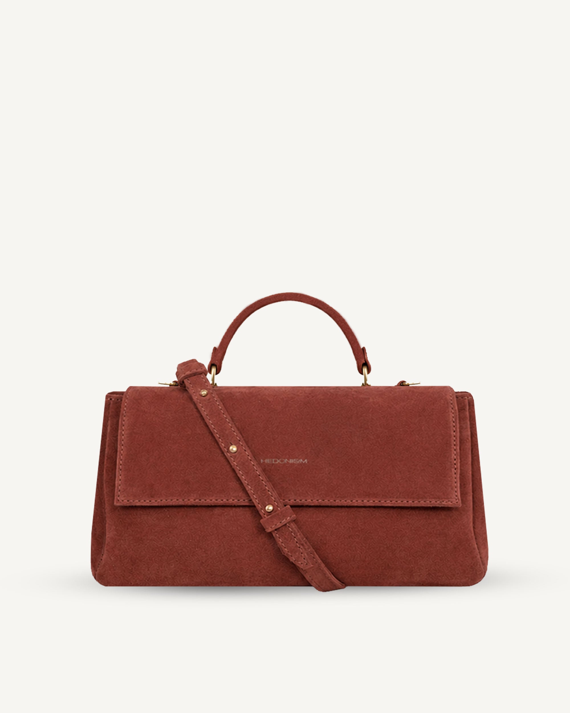 "Audrey Baguette" snake-embossed leather. Available in two colors.