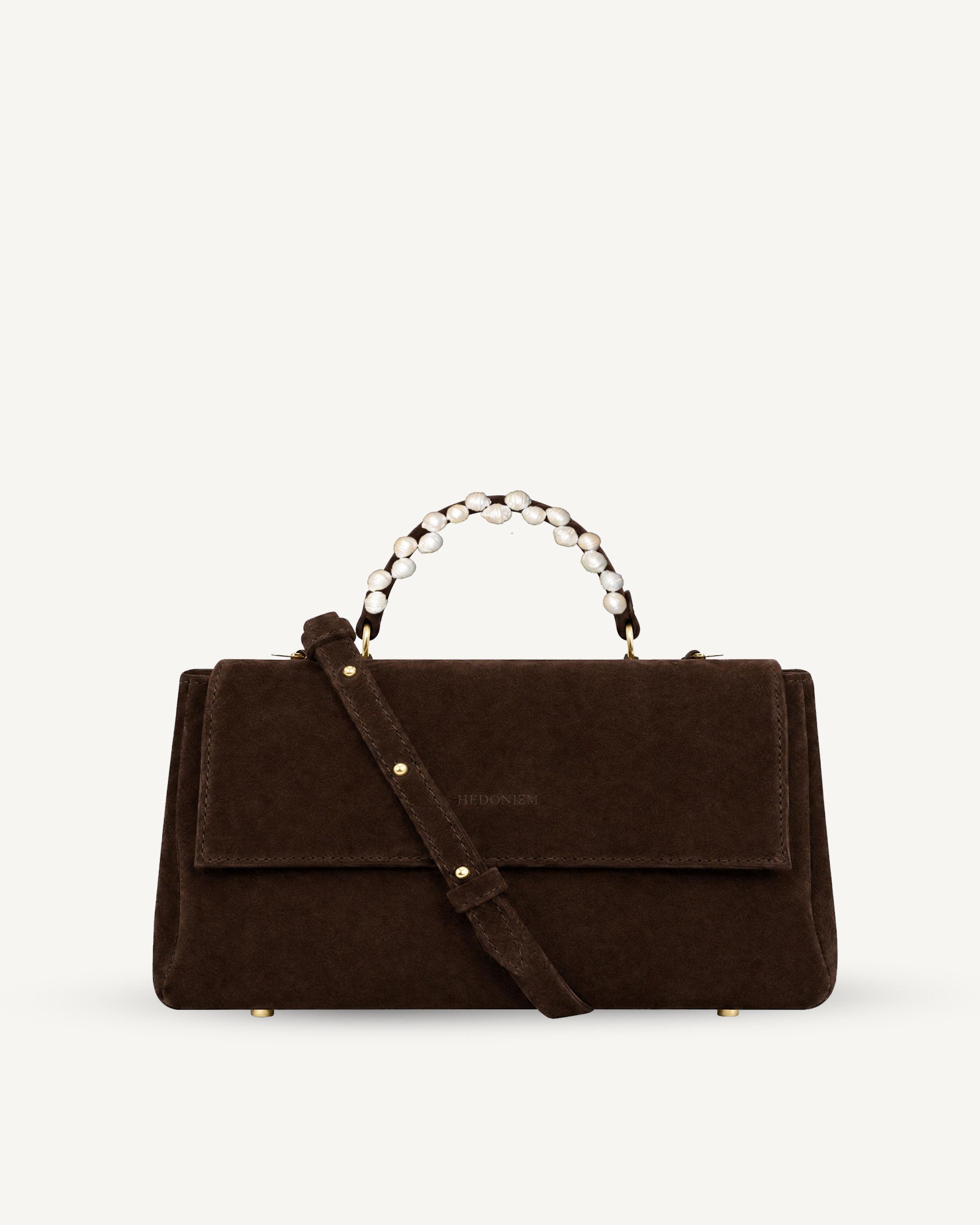 "Audrey Baguette" snake-embossed leather. Available in two colors.