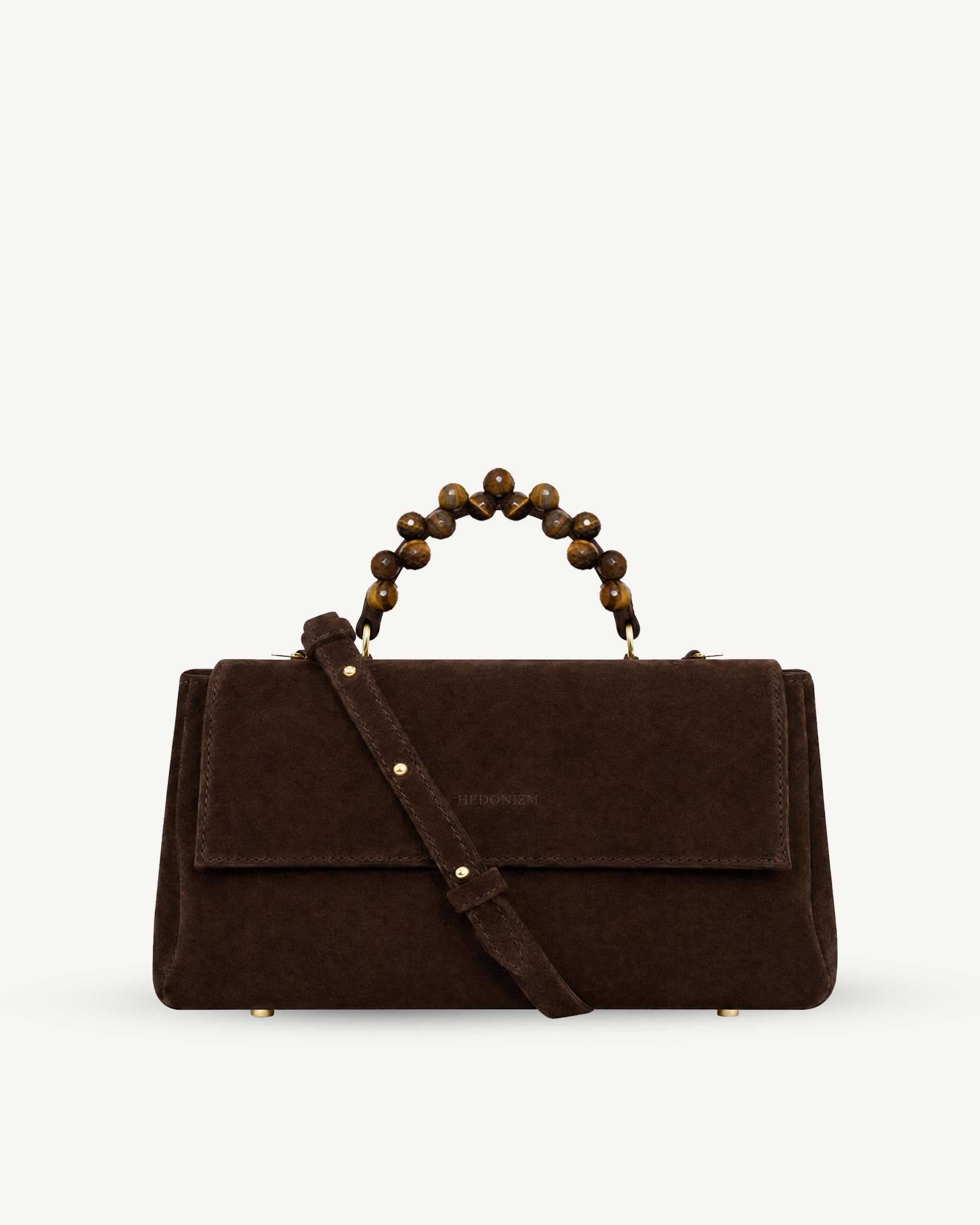 "Audrey" handbag with handle embossed on ostrich leather. Two colors