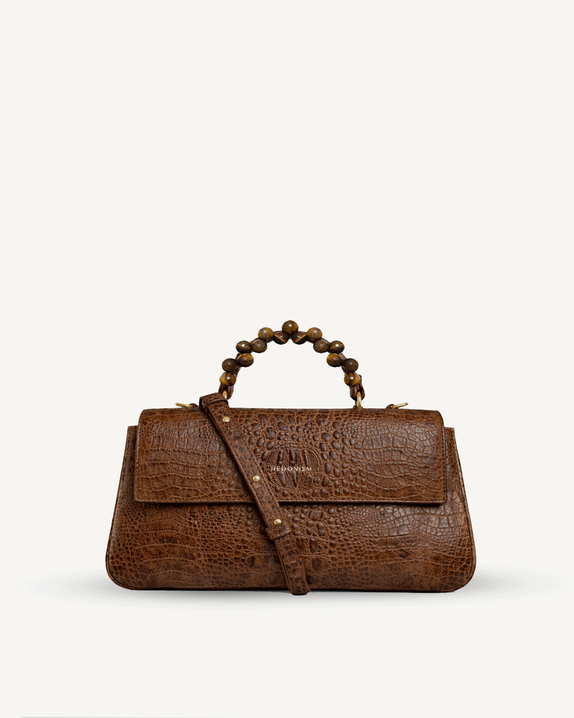 "Audrey Baguette" crocodile-embossed leather with faceted tiger's eye. Available in several leather colors.