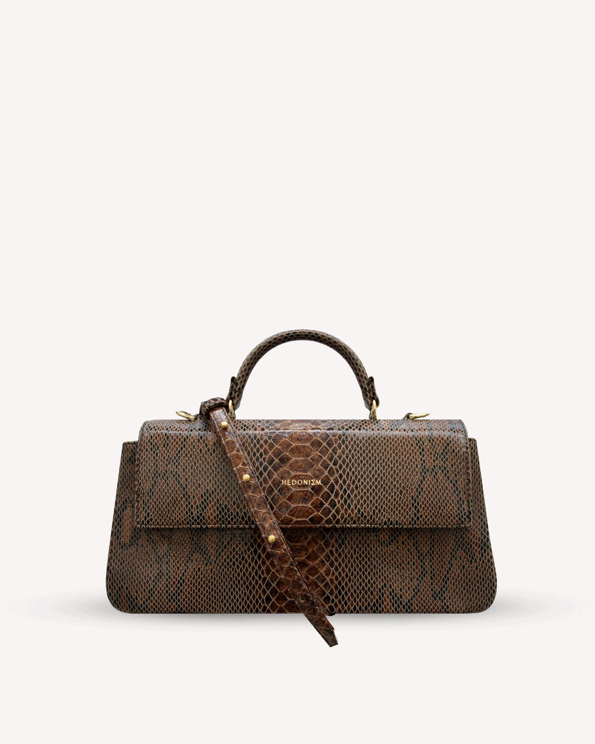 "Audrey Baguette" snake-embossed leather. Available in two colors.