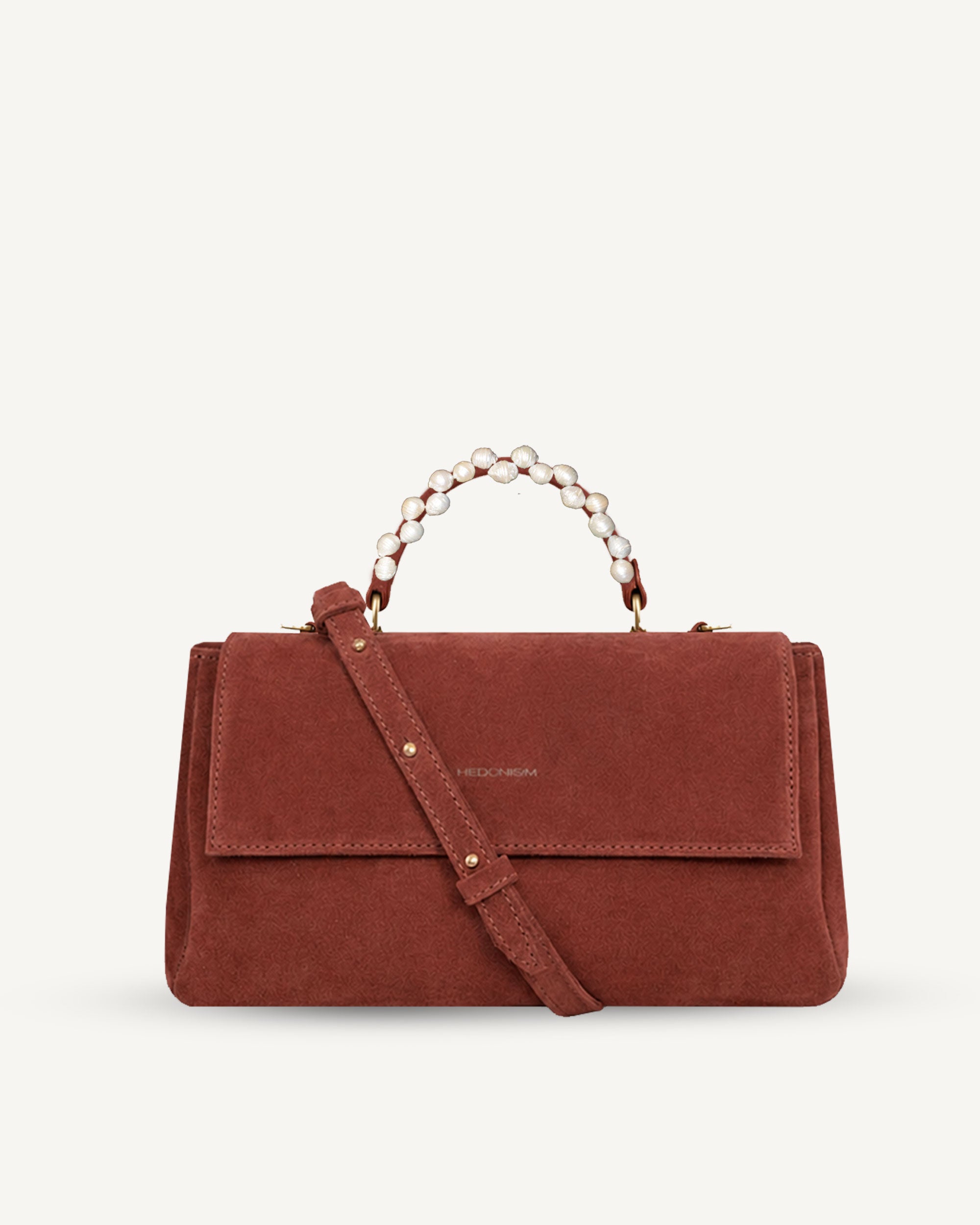 "Audrey M+" snake-embossed leather. Available in two colors.