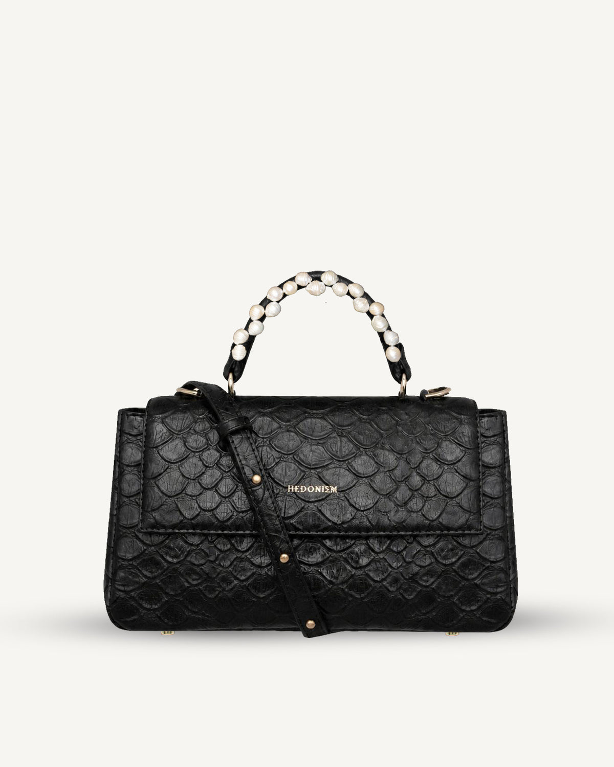 "Audrey M+" embossed scale-patterned leather with freshwater pearls. Available in two colours