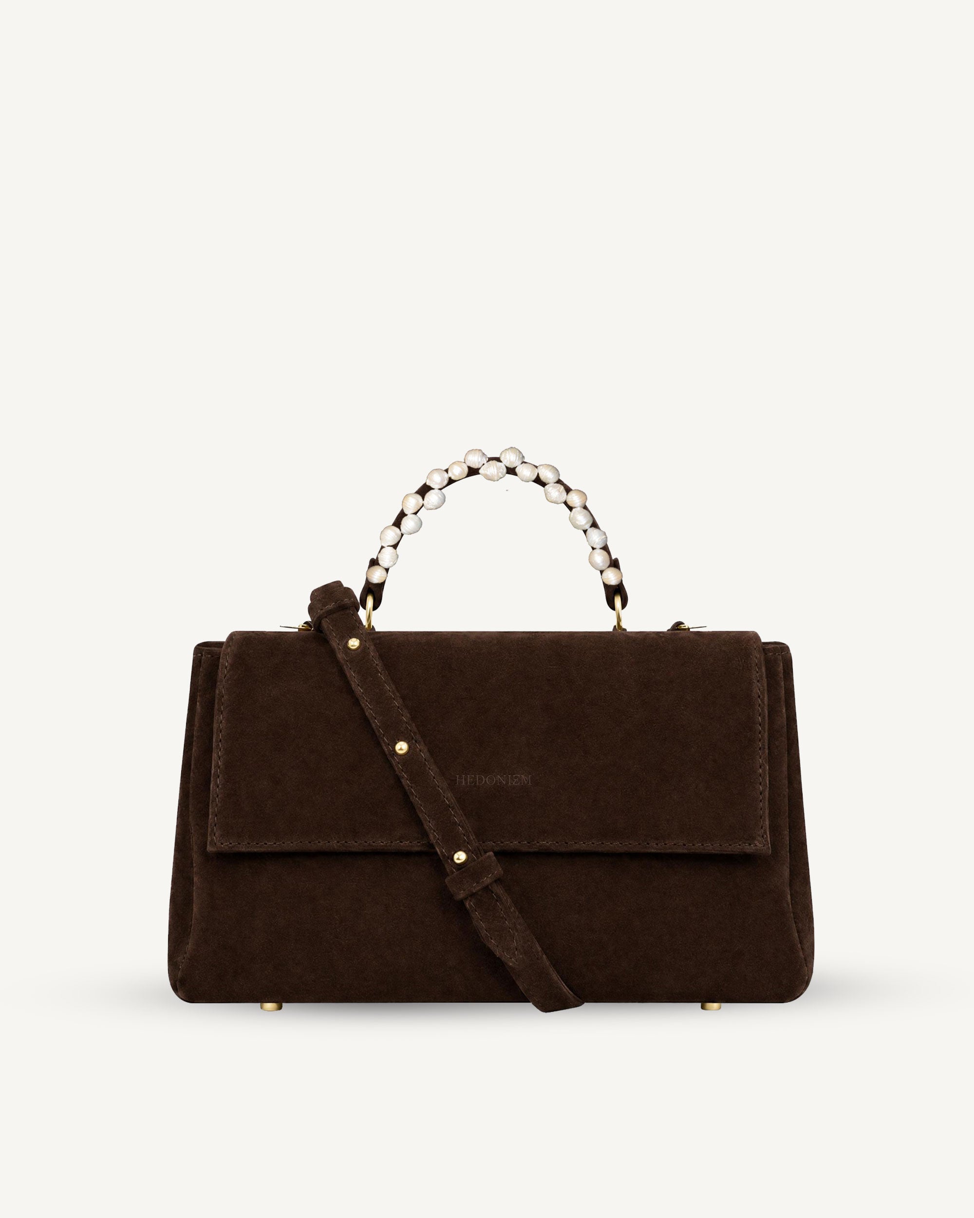 "Audrey M+" snake-embossed leather. Available in two colors.