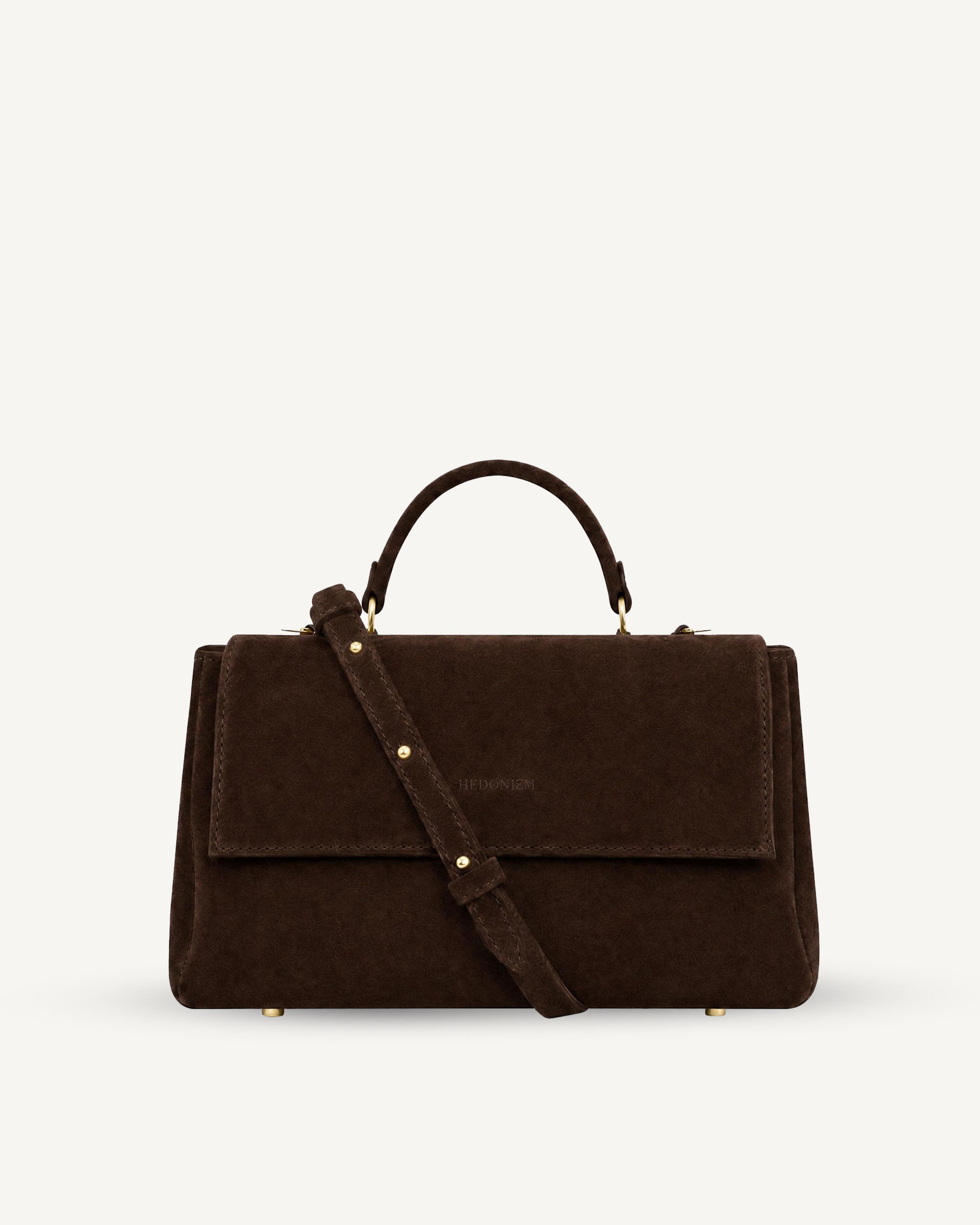 "Audrey M+" snake-embossed leather. Available in two colors.