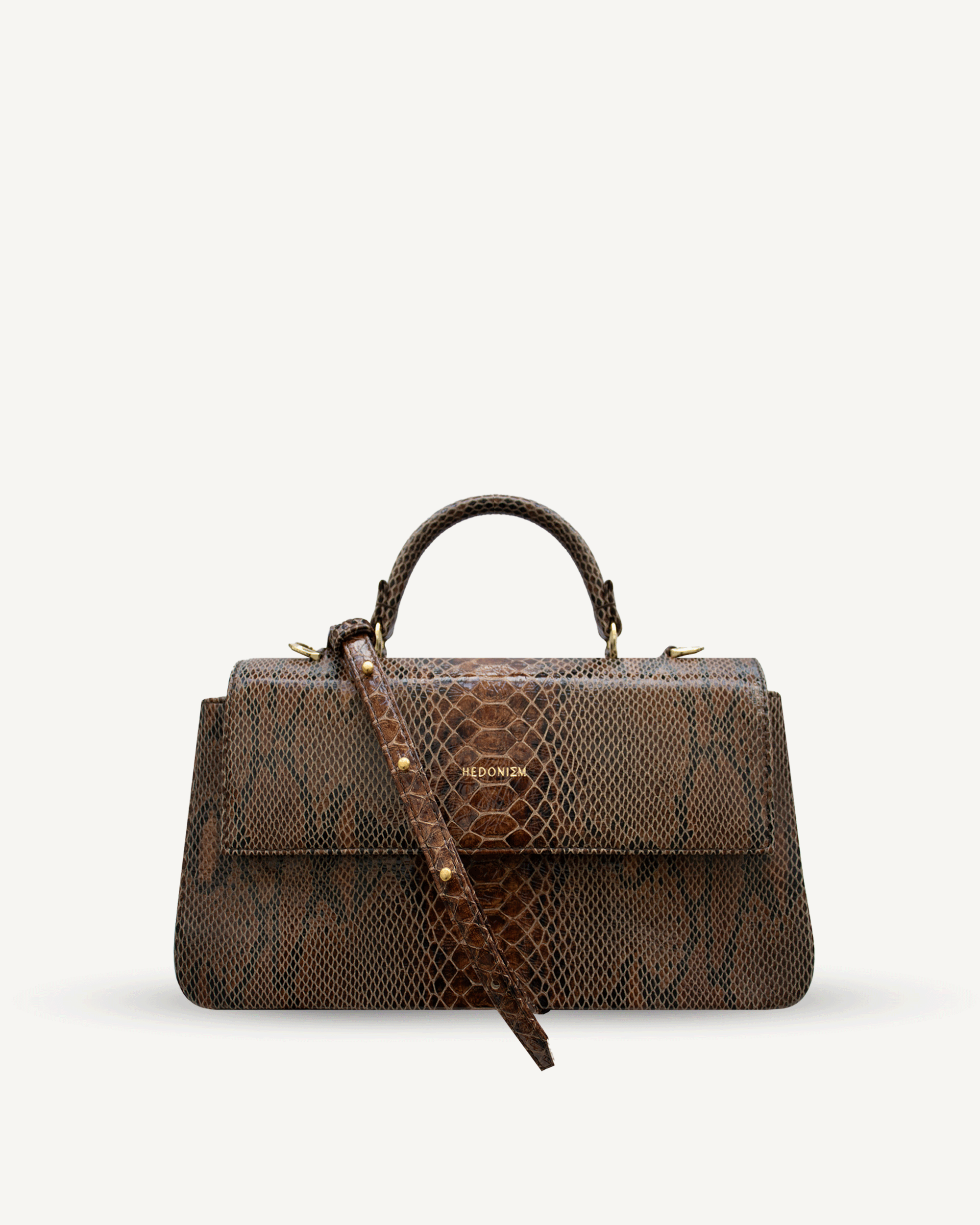 "Audrey M+" snake-embossed leather. Available in two colors.