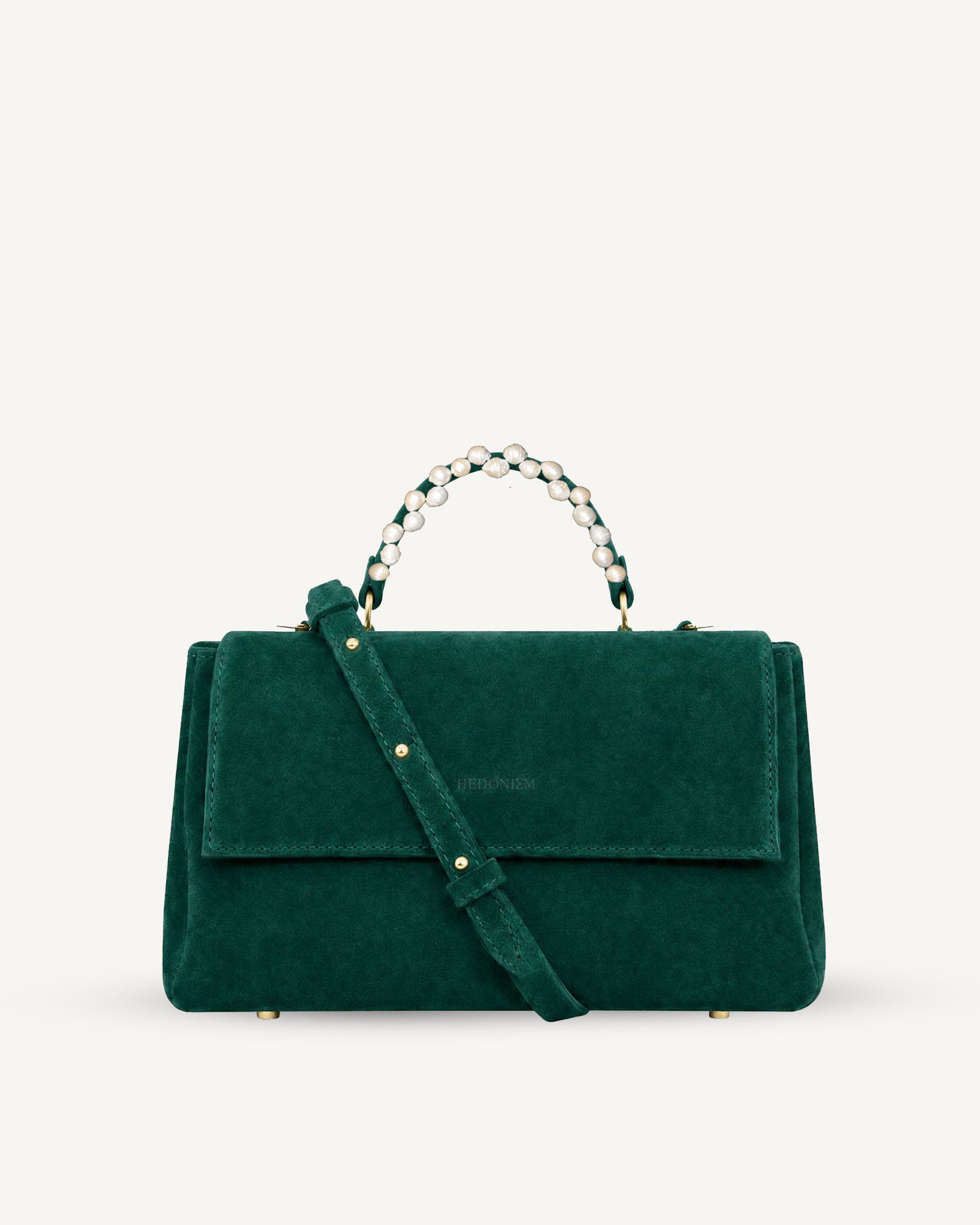 "Audrey M+" snake-embossed leather. Available in two colors.