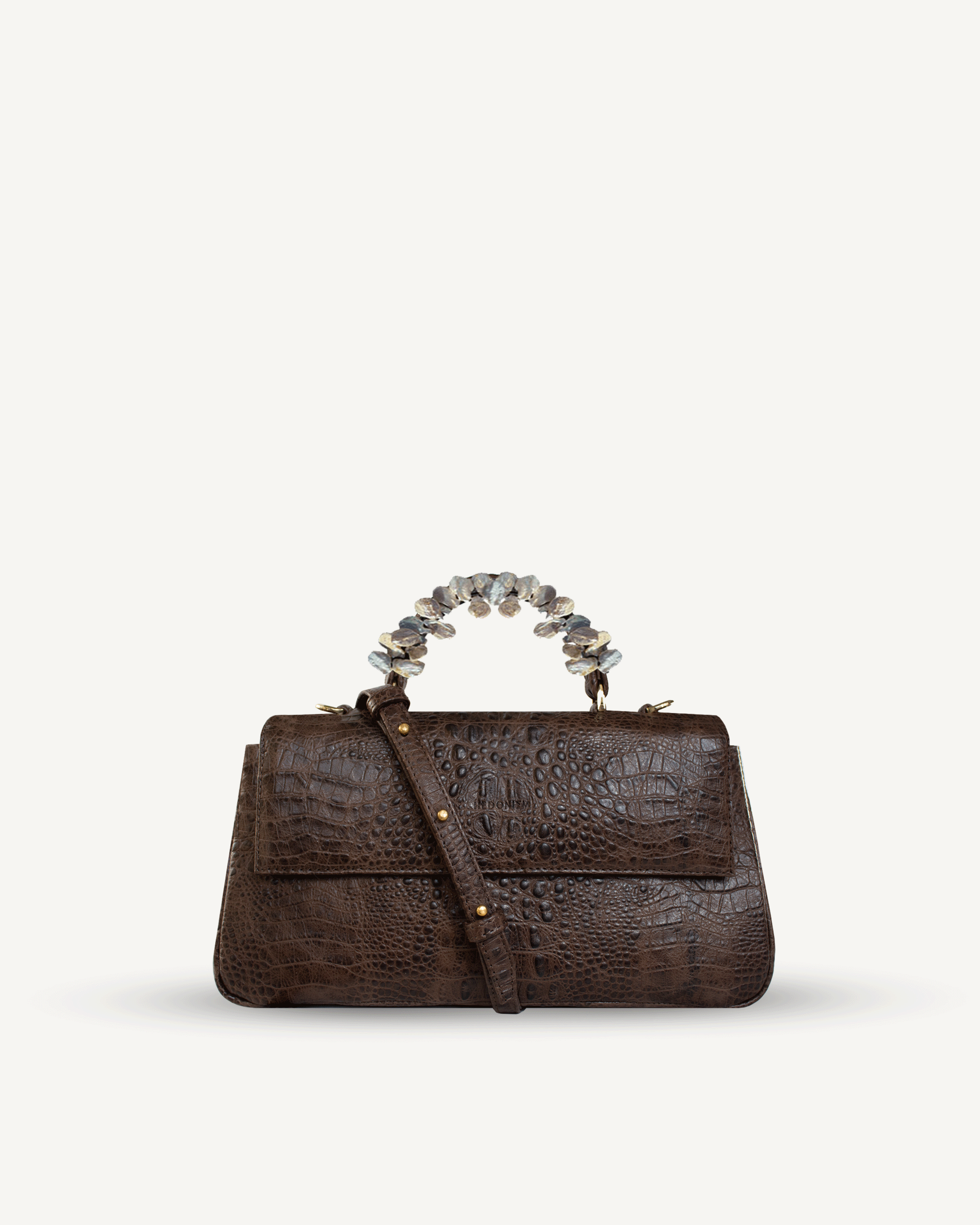 "Audrey" crocodile-embossed leather with freshwater pearls. Available in several colors.