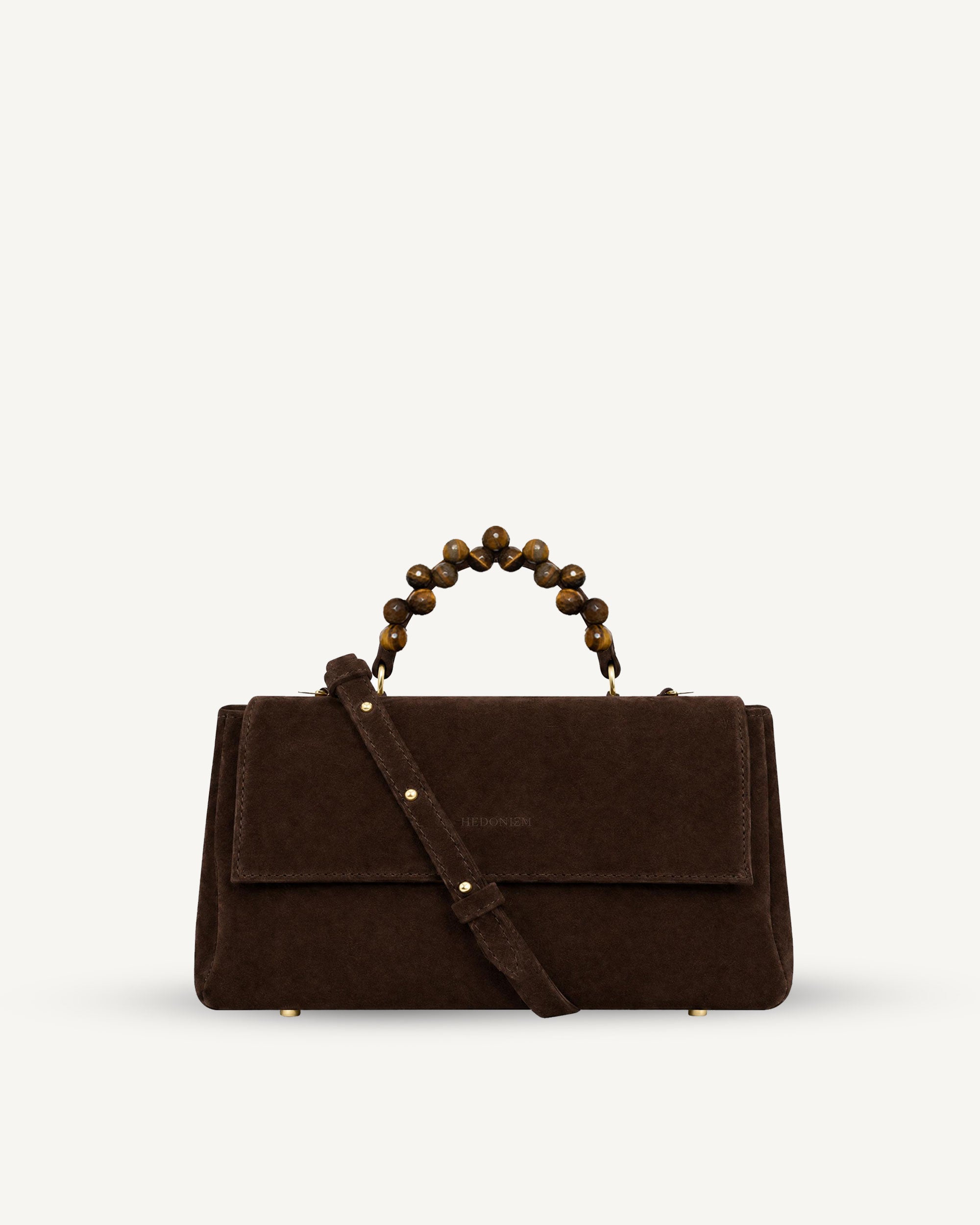 "Audrey" handbag with handle embossed on ostrich leather. Two colors