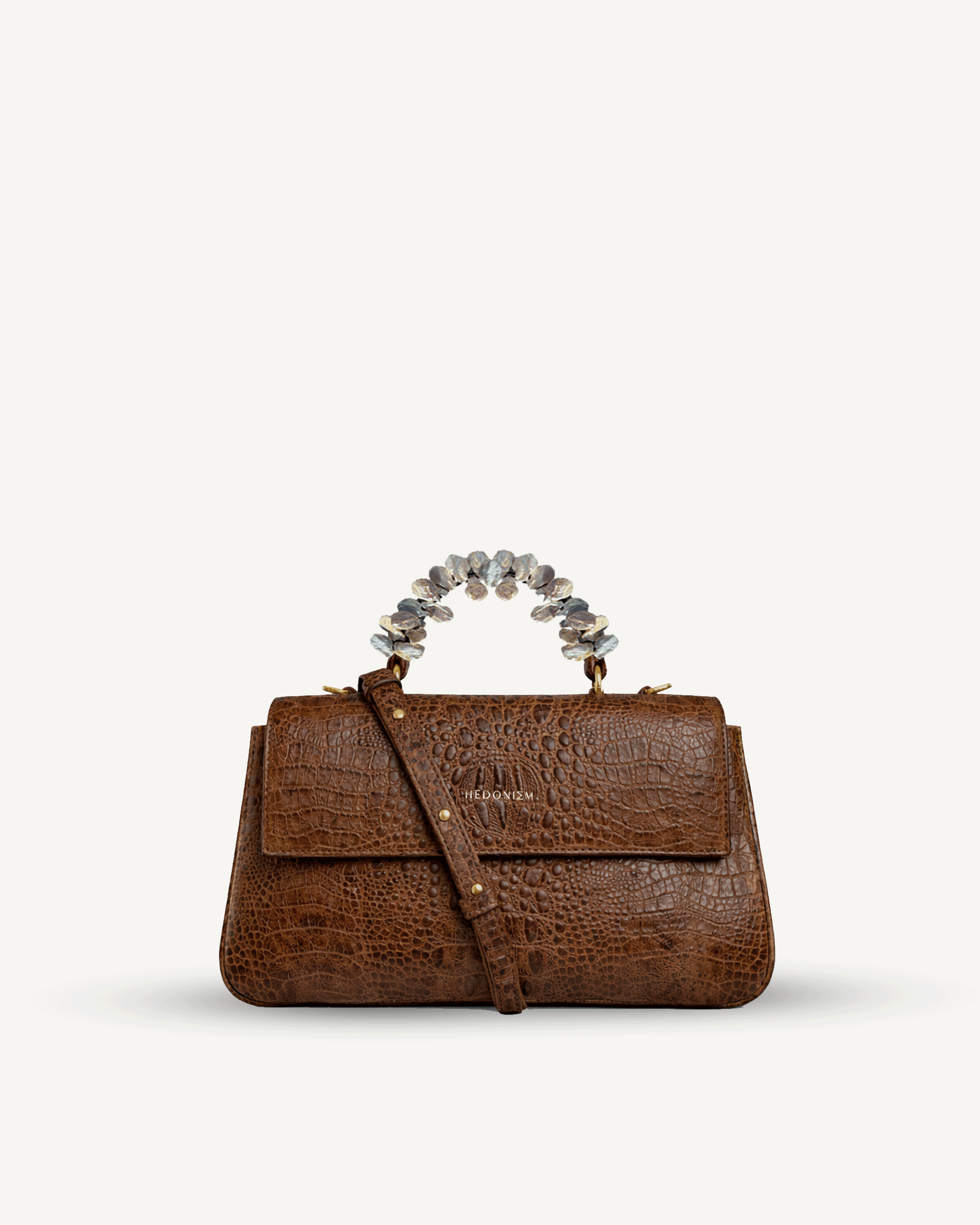 "Audrey" crocodile-embossed leather with freshwater pearls. Available in several colors.