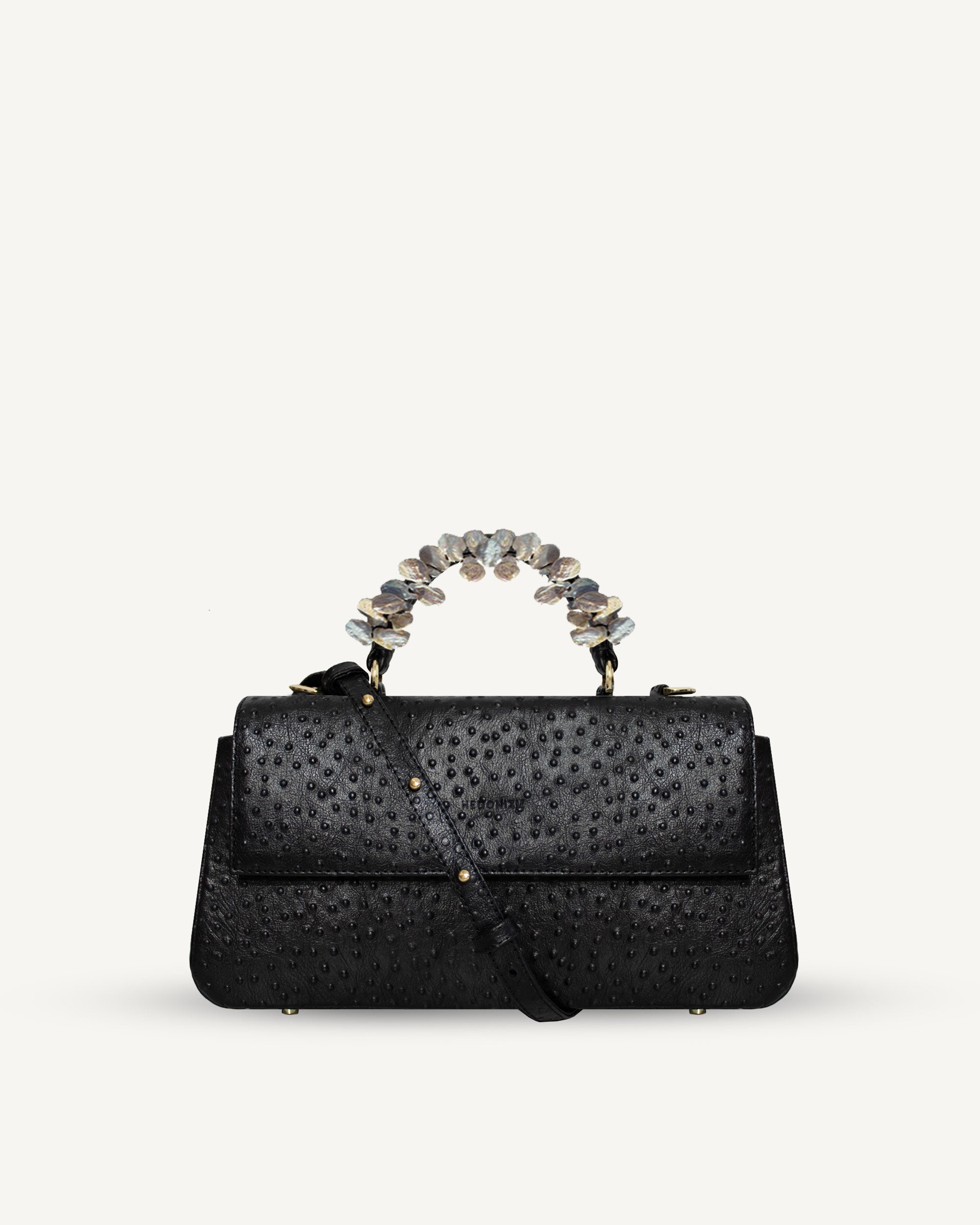 "Audrey" with freshwater pearls and ostrich-effect leather. Two colors