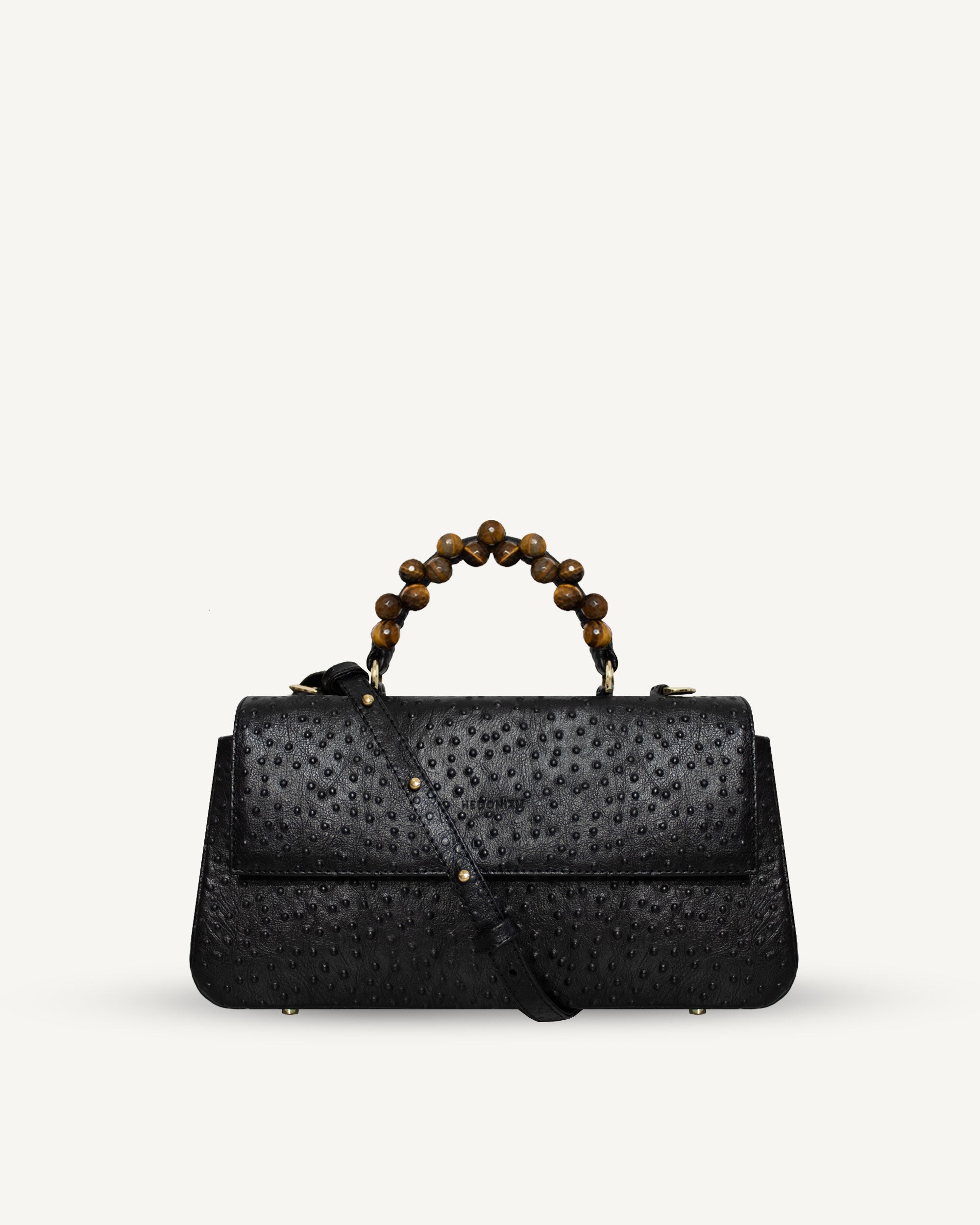 "Audrey" with tiger's eye, ostrich-embossed leather. Available in two colors