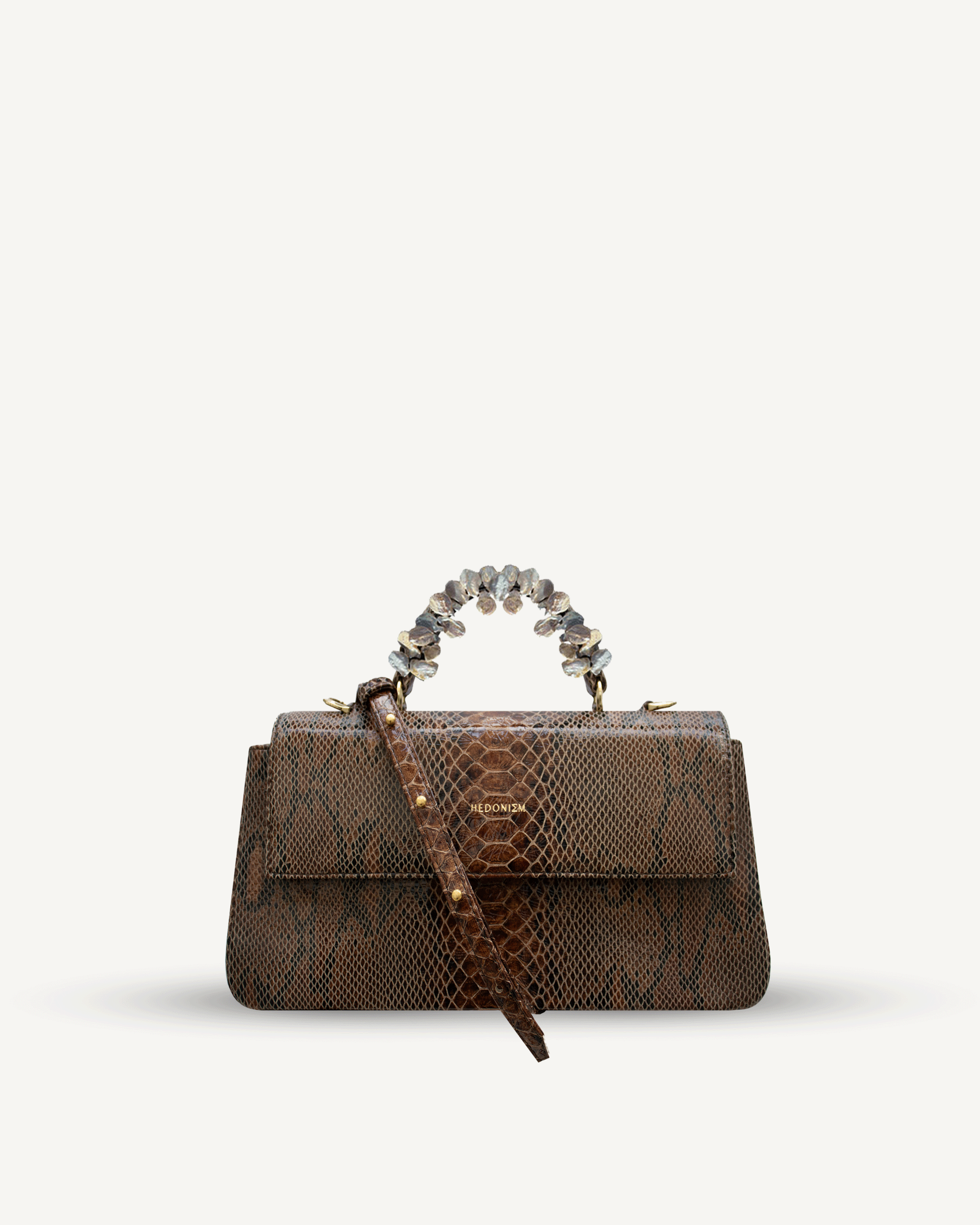 "Audrey" snake-embossed leather with freshwater pearls. Available in two colors.