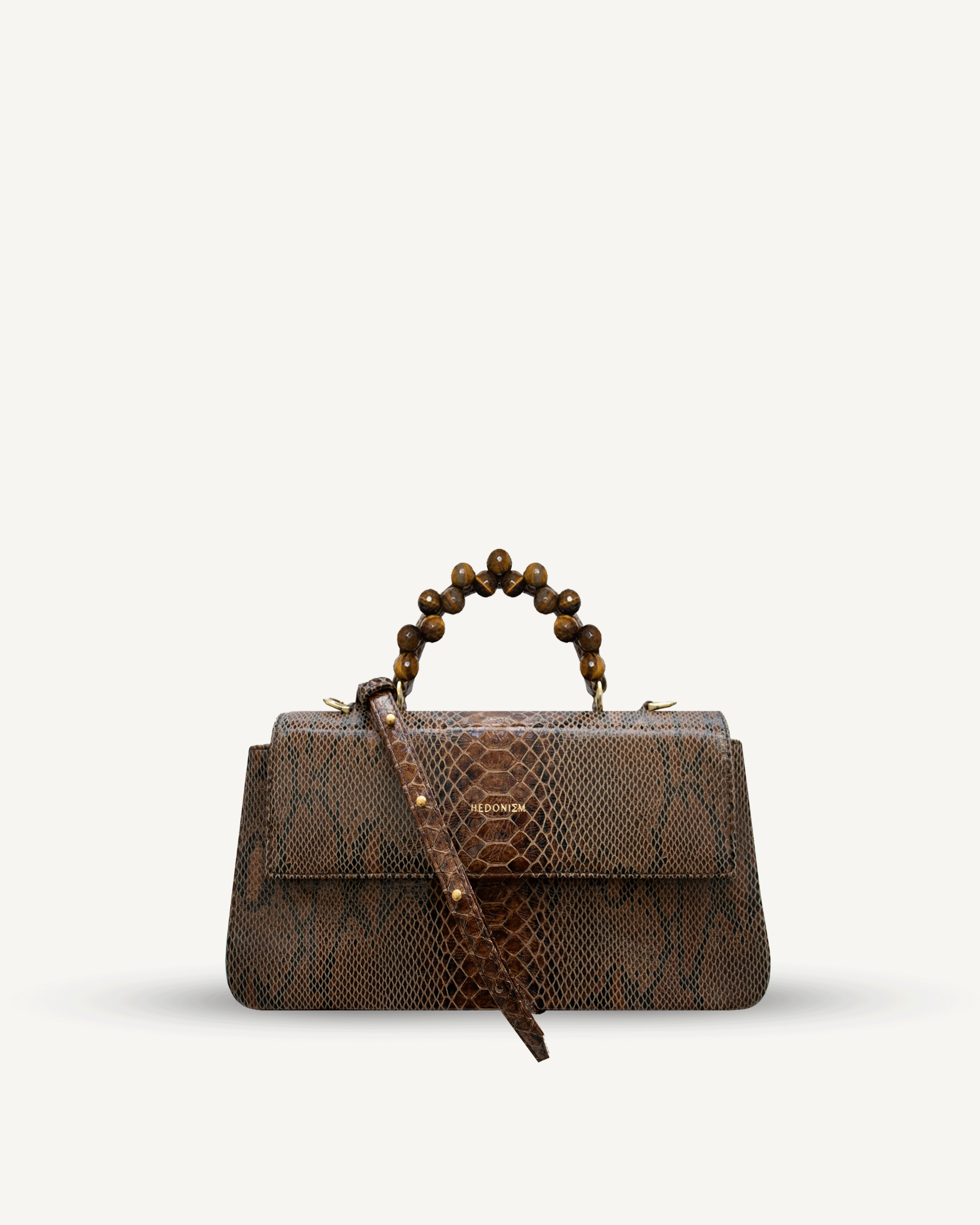 "Audrey" leather embossed with a snake-like pattern and tiger's eye. Available in two colors.