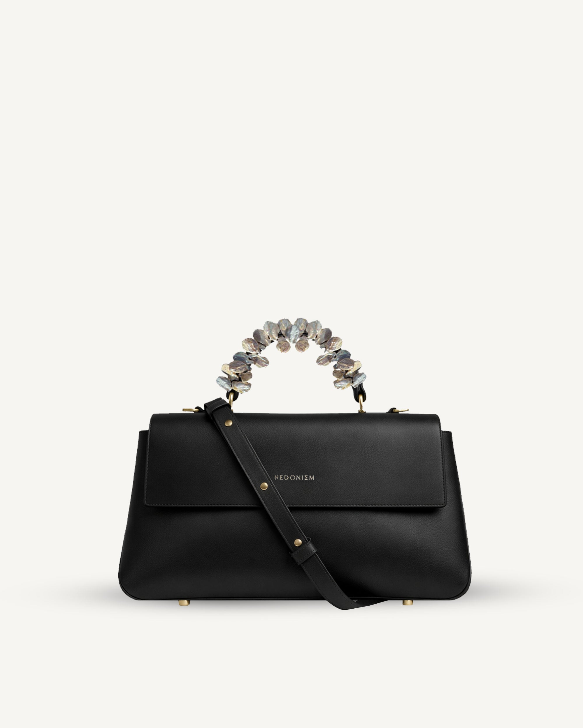 "Audrey" snake-embossed leather with freshwater pearls. Available in two colors.