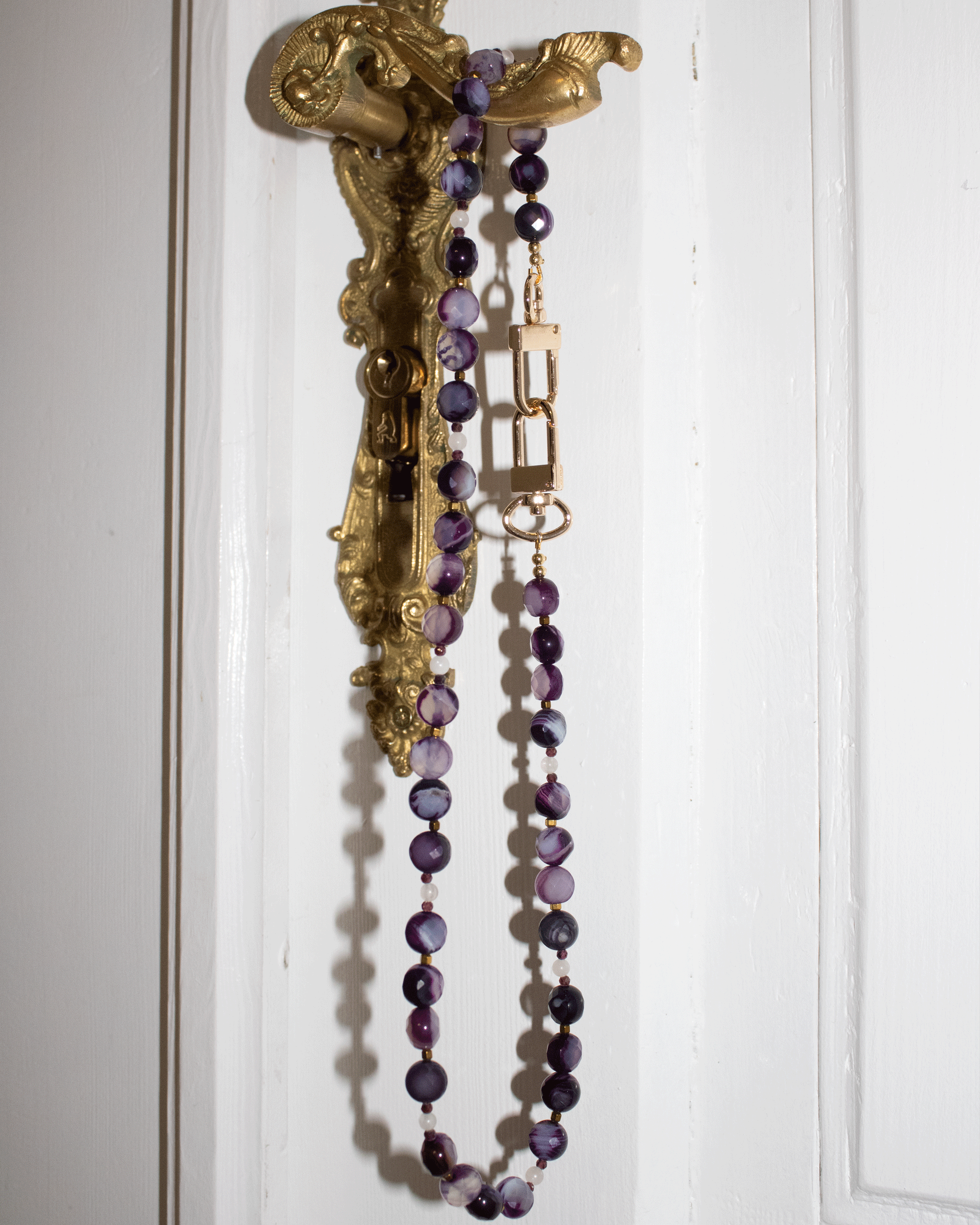 Faceted purple agates and gold-colored hematite