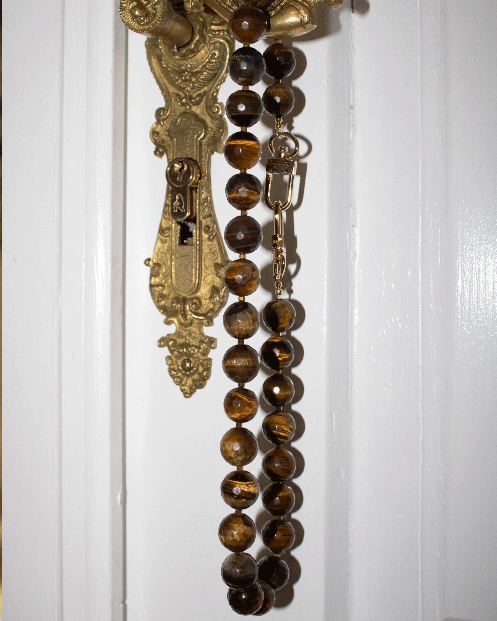 Faceted tiger's eye and gold-colored hematite