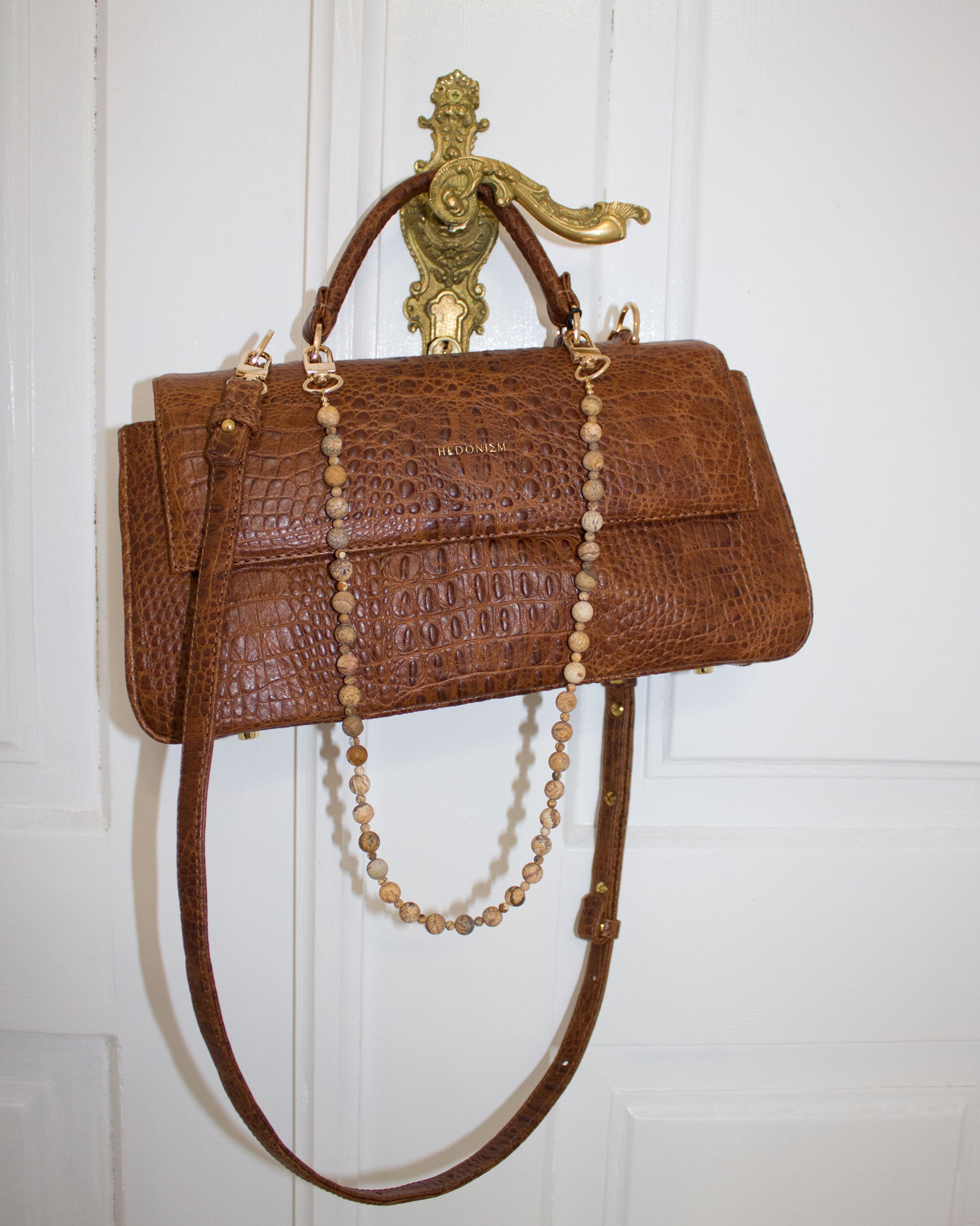 Faceted purple agates and gold-colored hematite