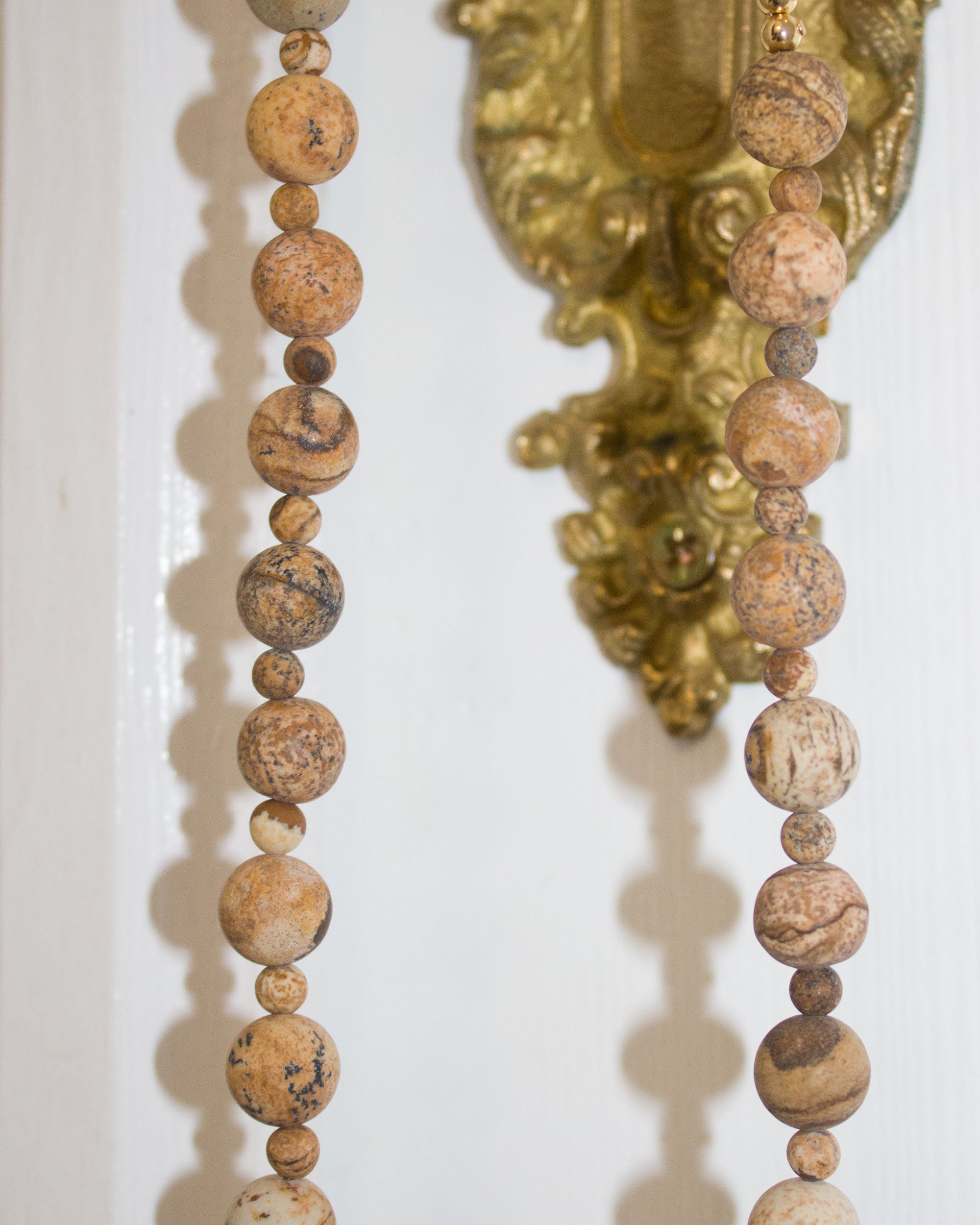 Faceted purple agates and gold-colored hematite