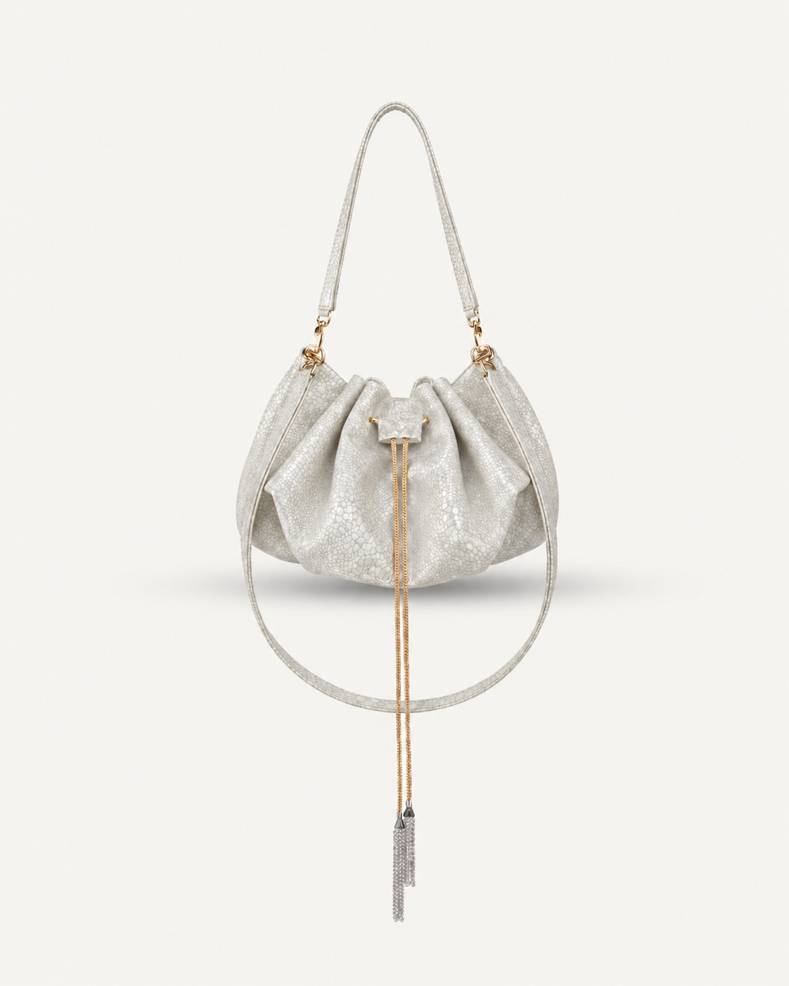 Mini worek "Retro" z rączką i paskiem na ramię. Błyszcząca skóra tłoczona na wzór węża, dostępna w kilku kolorach.