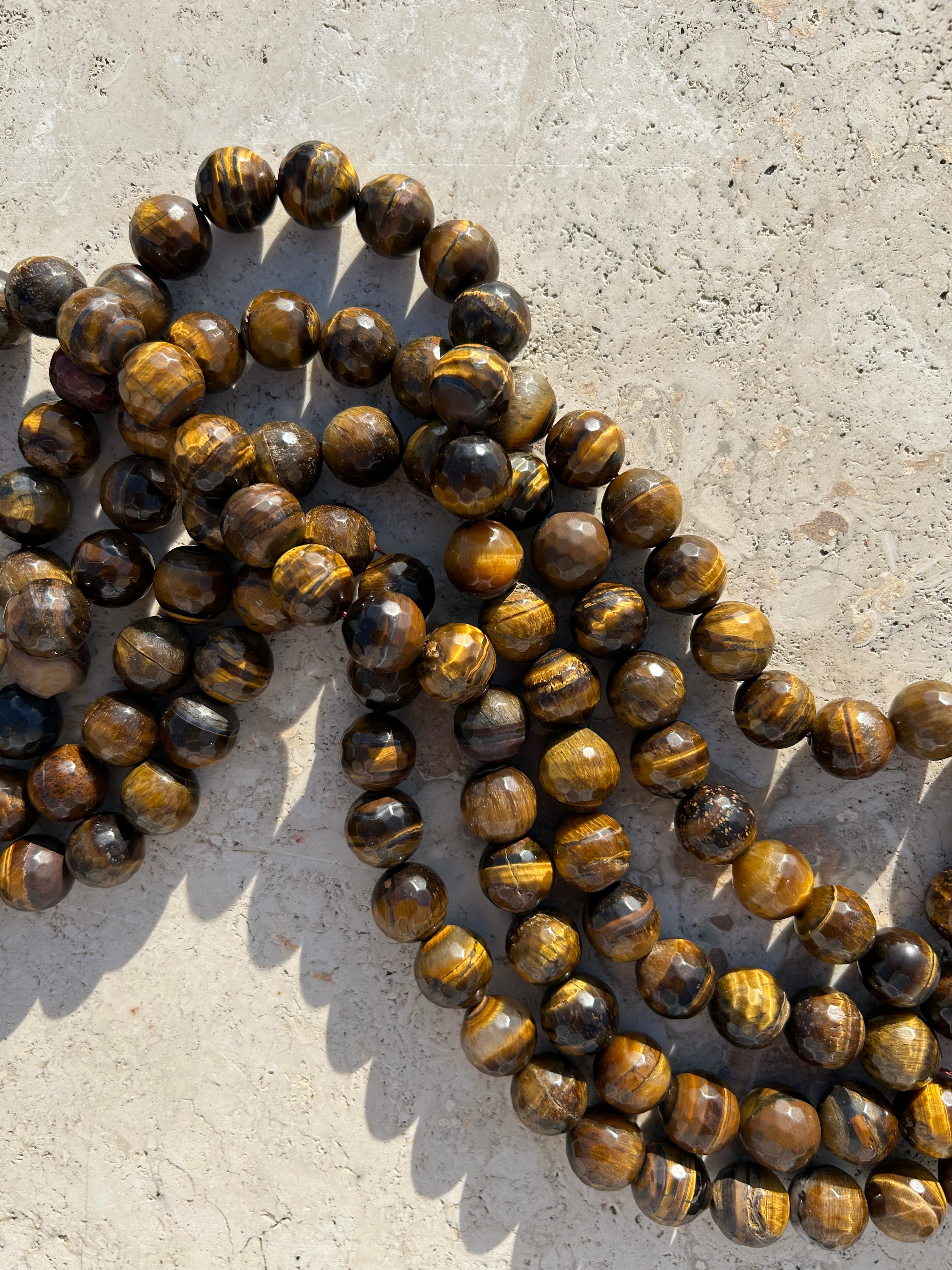 "Audrey Baguette" crocodile-embossed leather and faceted tiger's eye. Last piece.