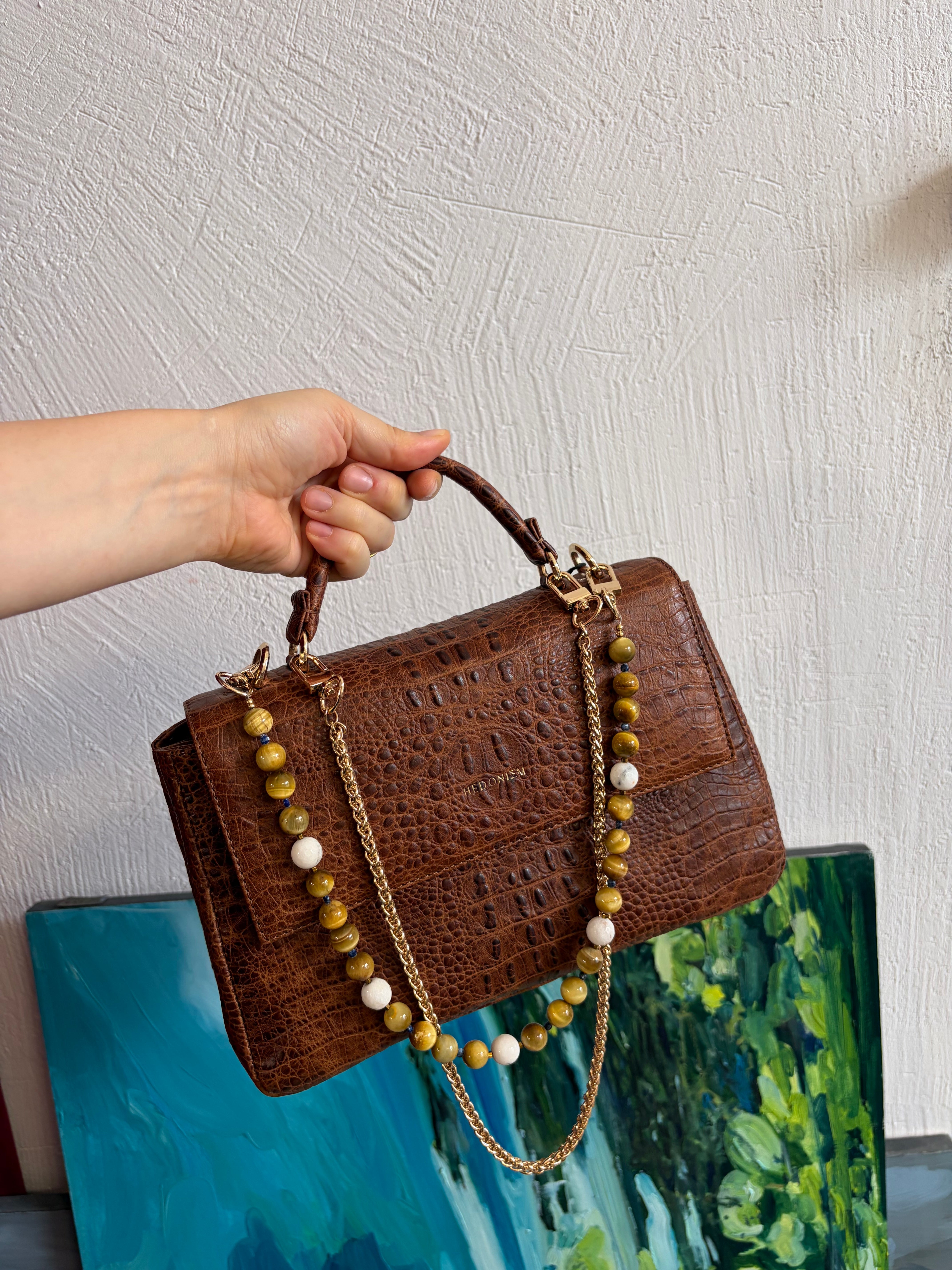 "Audrey M+" crocodile-embossed leather. Several leather colors.