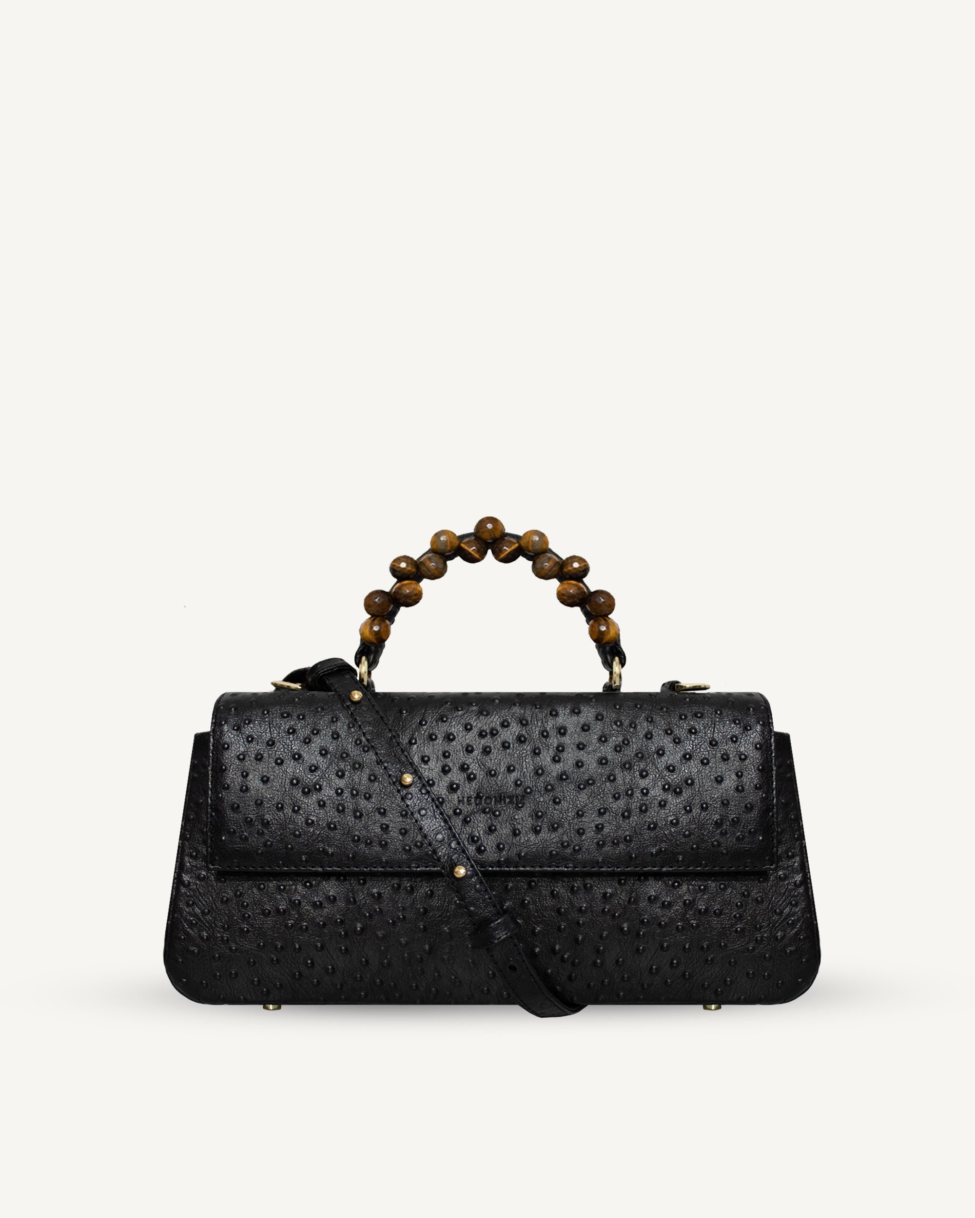 "Audrey Baguette" with tiger's eye, ostrich-embossed leather. Available in two colors