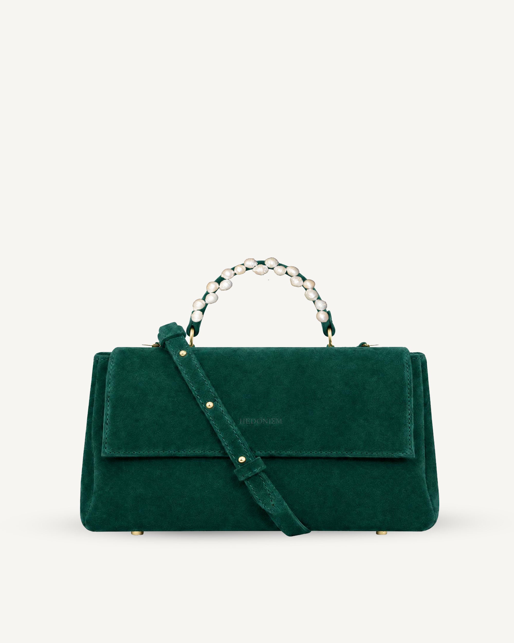 "Audrey Baguette" snake-embossed leather. Available in two colors.