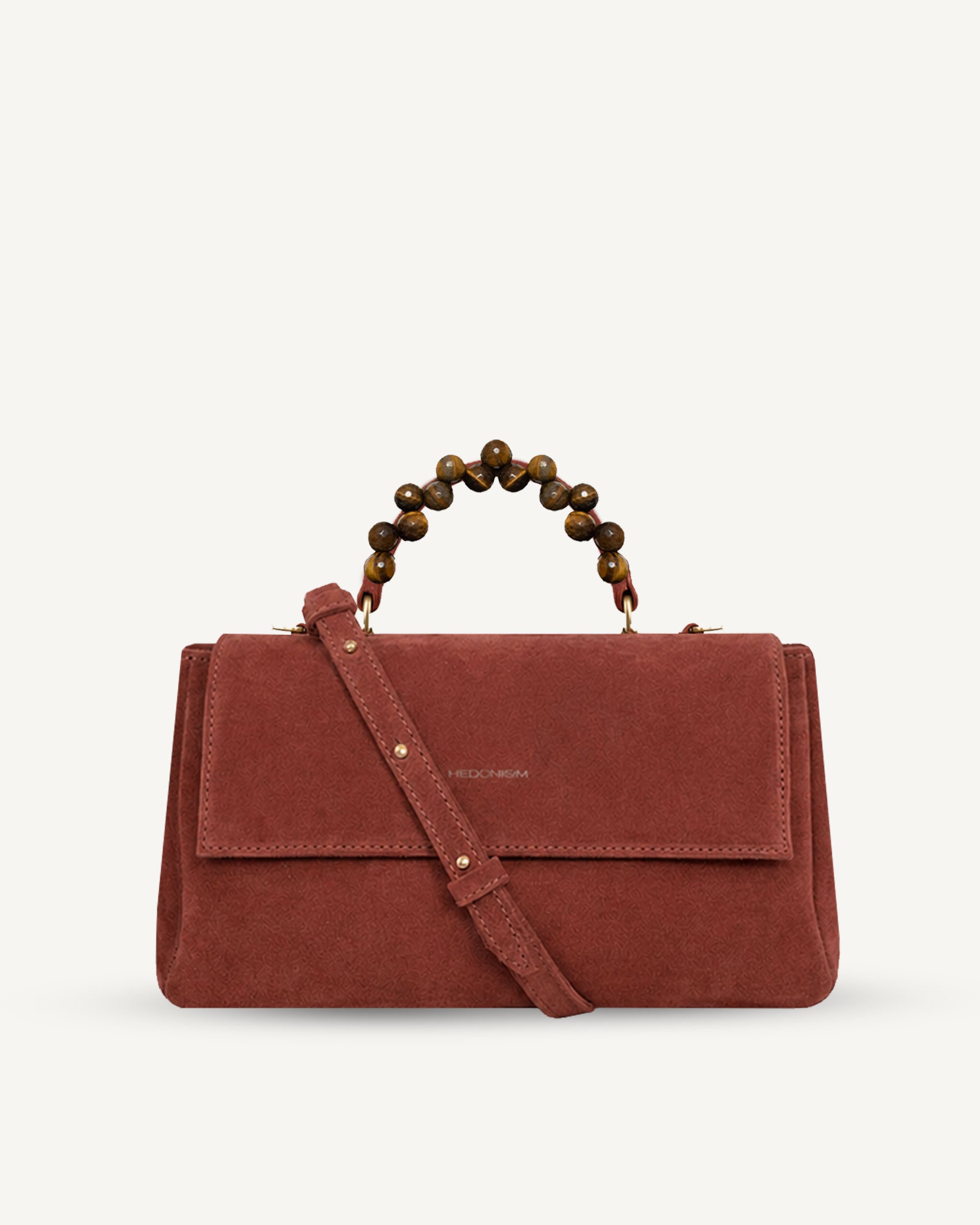 "Audrey" handbag with handle embossed on ostrich leather. Two colors