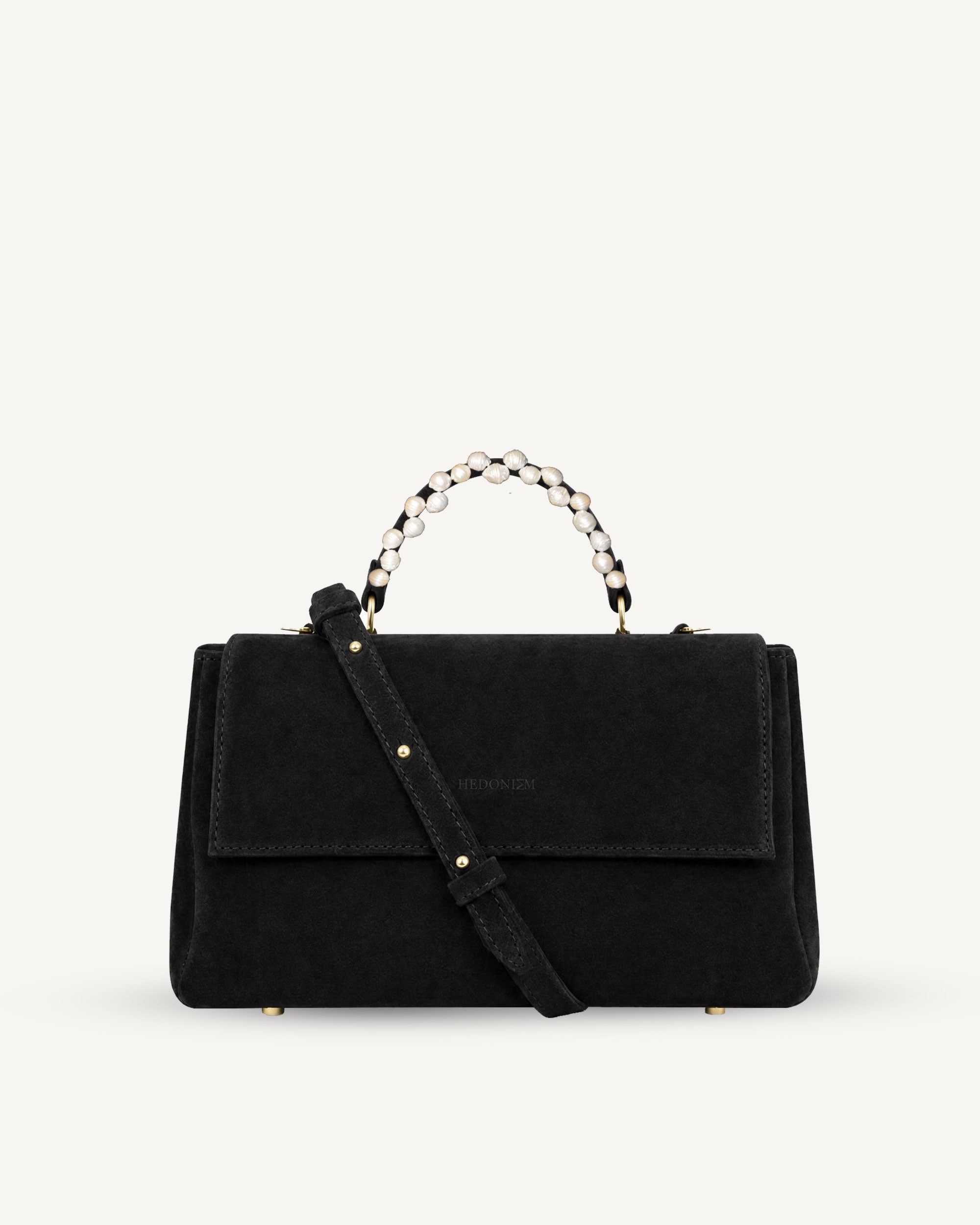 "Audrey M+" snake-embossed leather. Available in two colors.