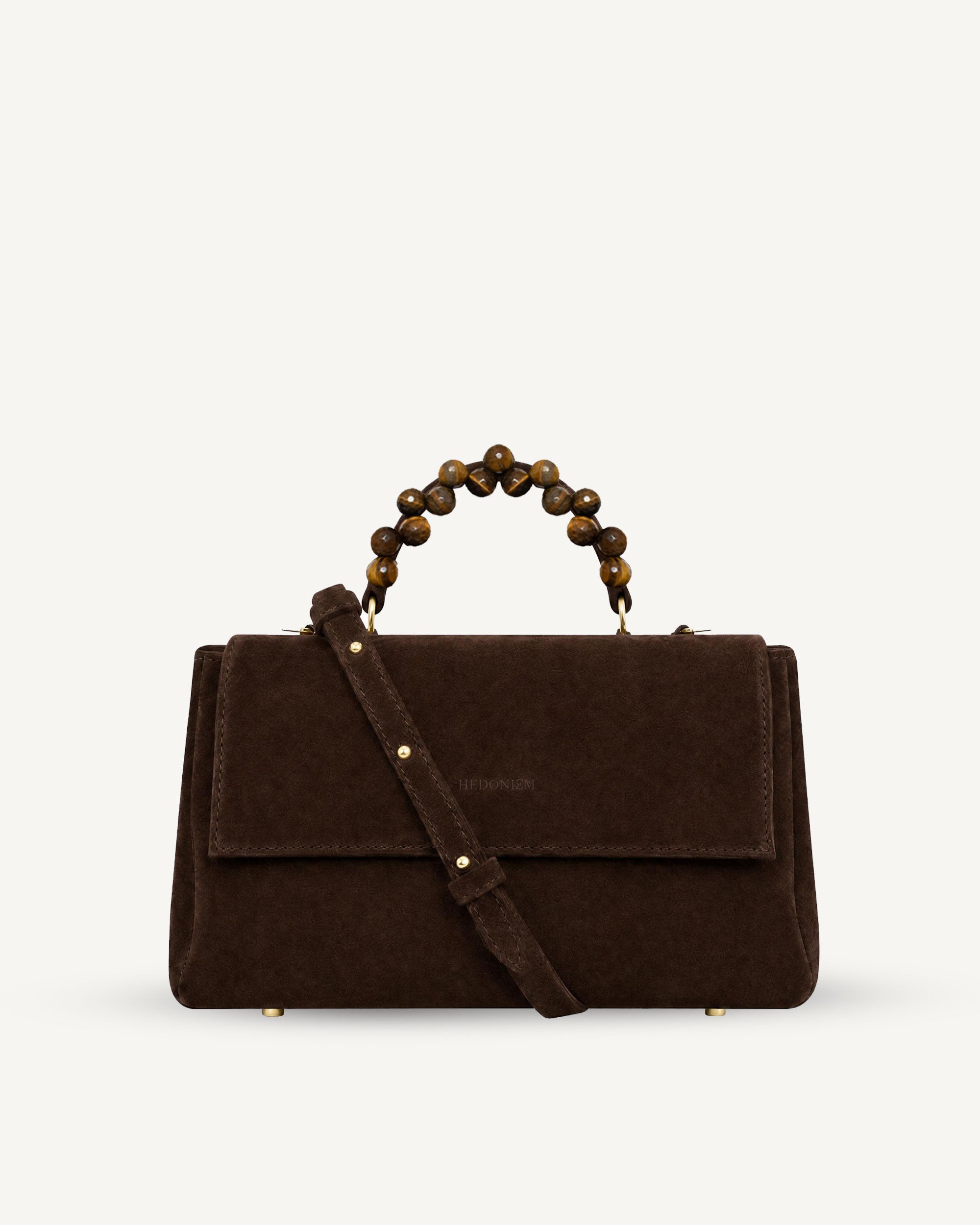 "Audrey" handbag with handle embossed on ostrich leather. Two colors