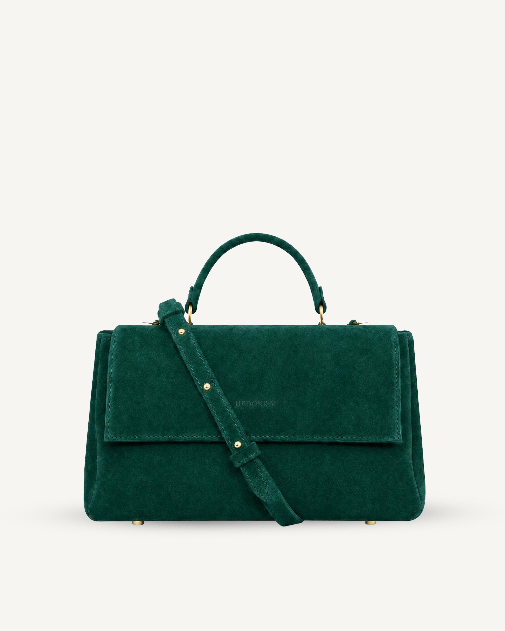 "Audrey M+" snake-embossed leather. Available in two colors.