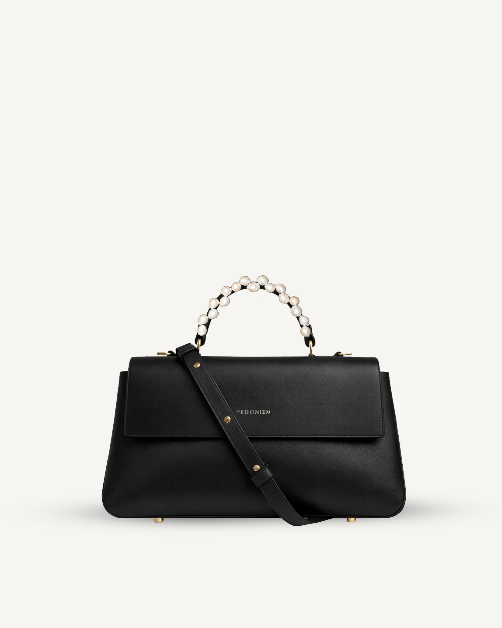 "Audrey" snake-embossed leather with freshwater pearls. Available in two colors.