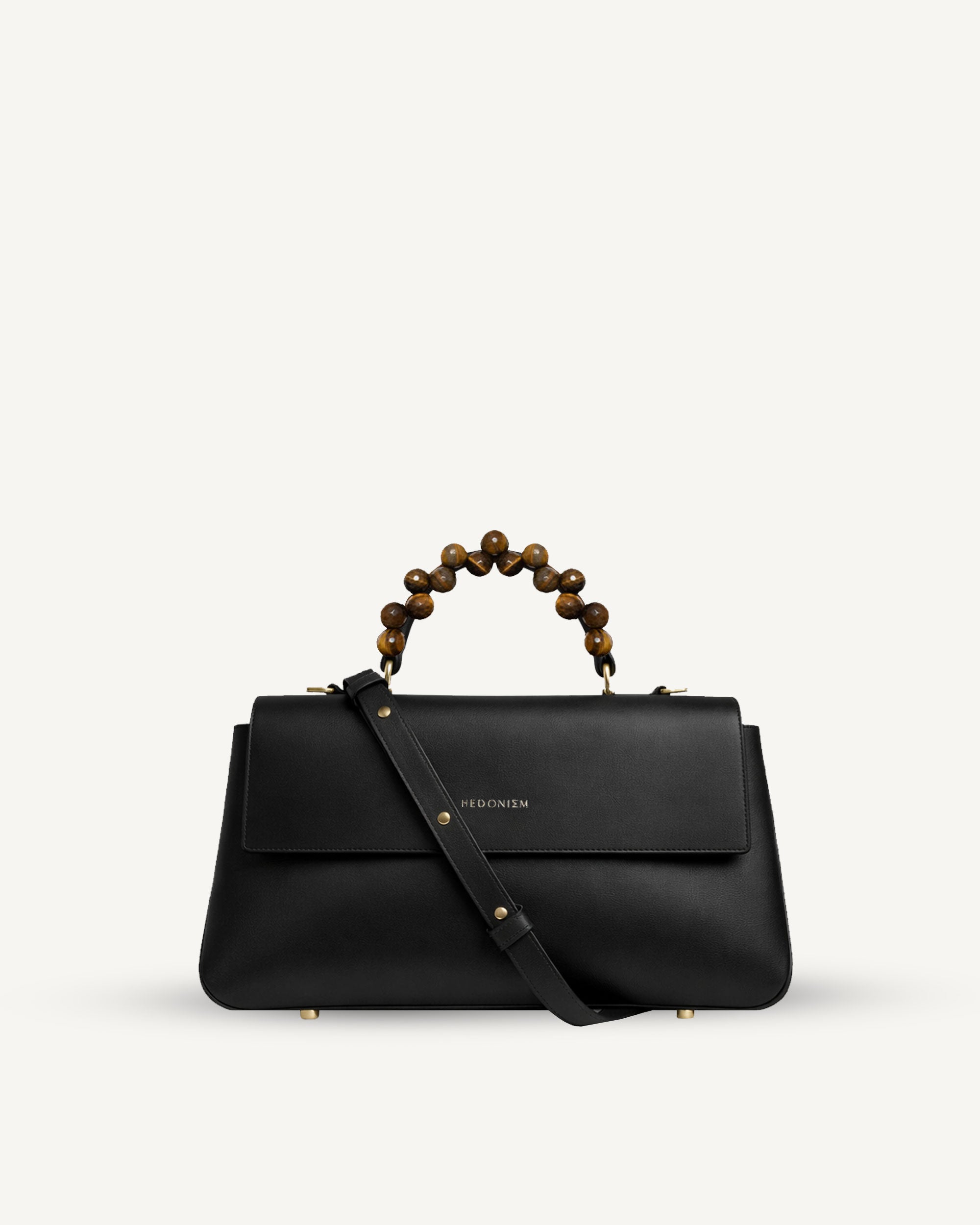 "Audrey" leather embossed with a snake-like pattern and tiger's eye. Available in two colors.