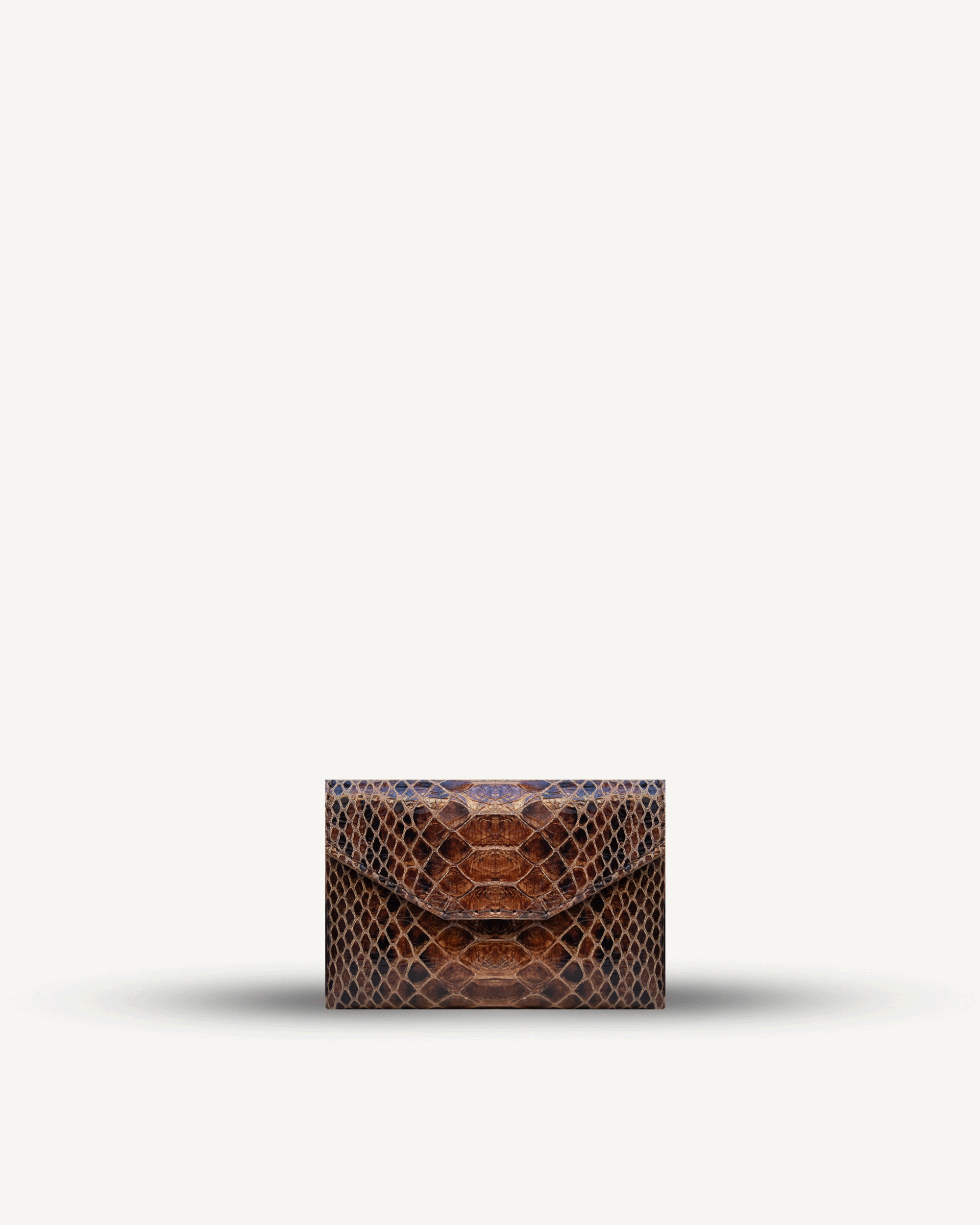 Cardholder No. 1, embossed snakeskin. Available in two colors.