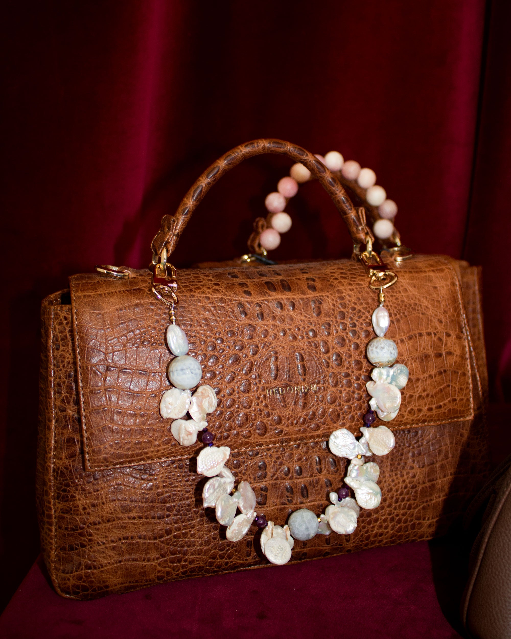 A string of freshwater pearls in two colors, faceted agates, hematite, and jasper. Limited Edition