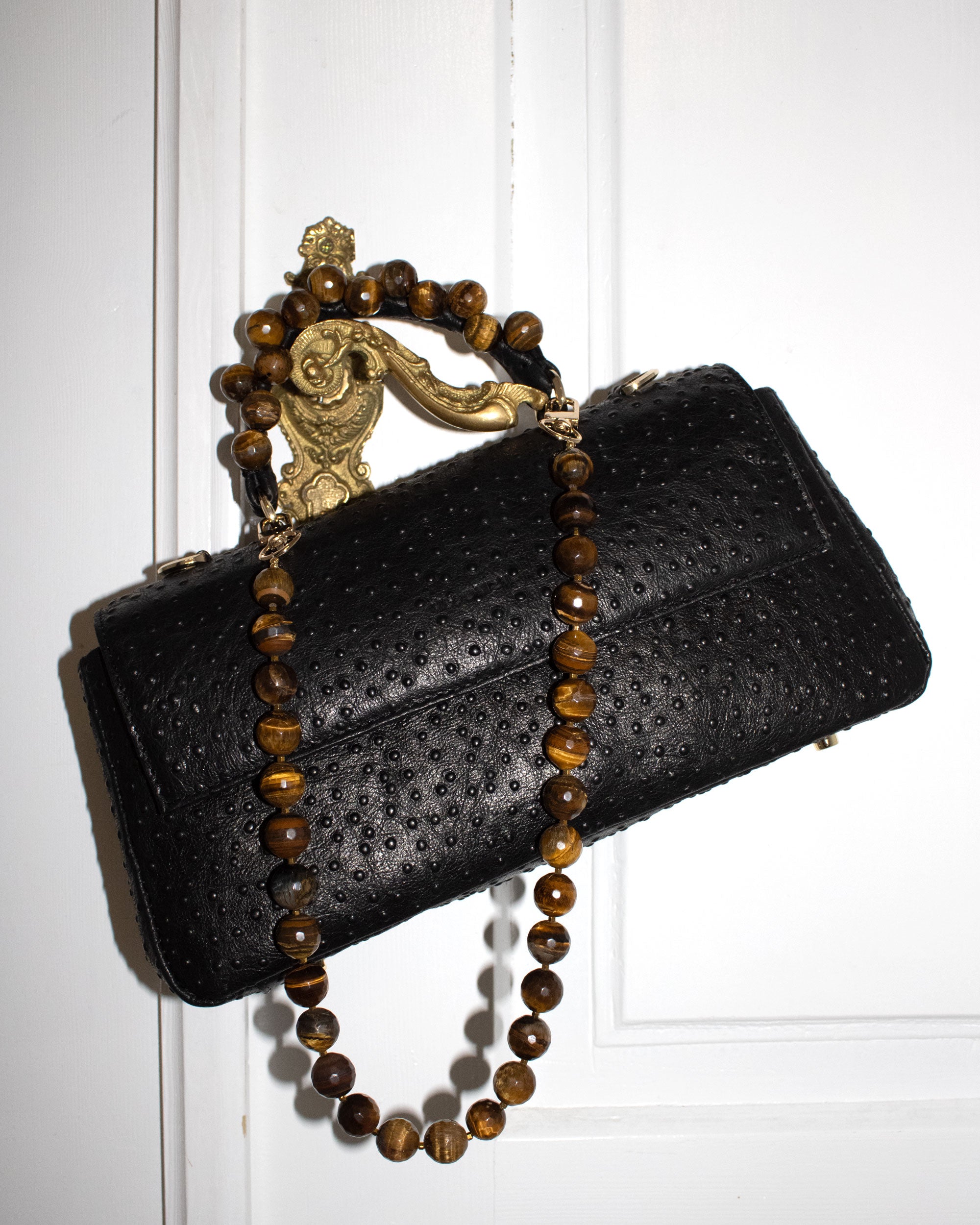 Faceted tiger's eye and gold-colored hematite