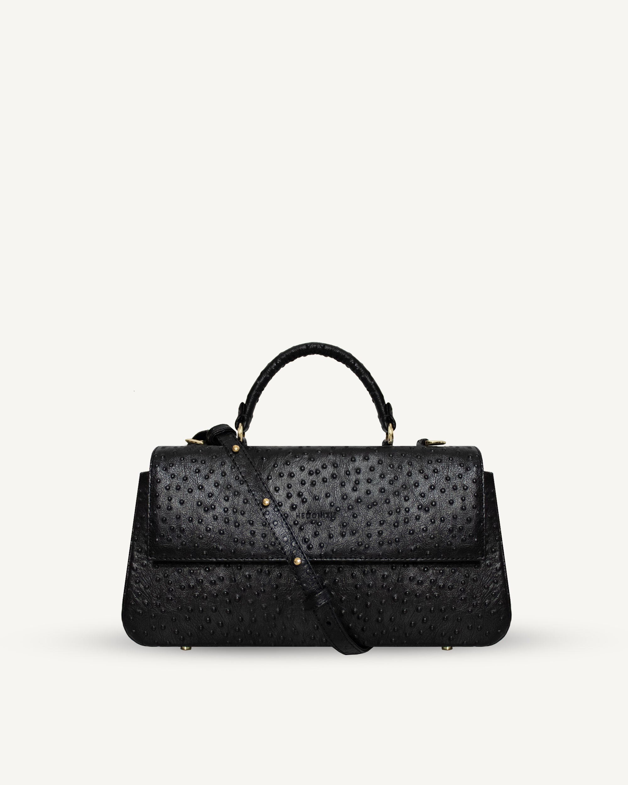 "Audrey" handbag with handle embossed on ostrich leather. Two colors